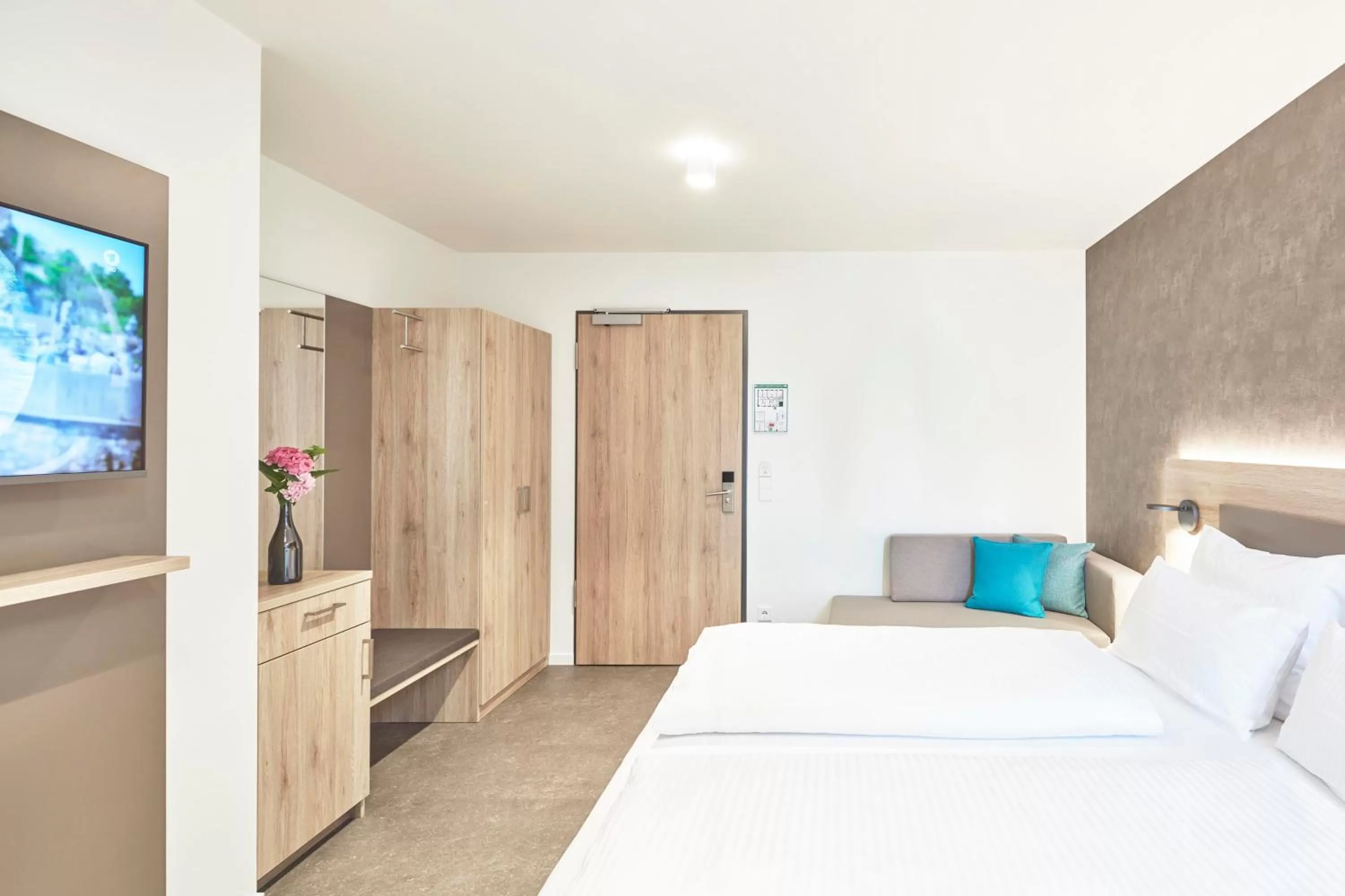 Bed in Gästehaus Bauer - Schlafen auf dem Weingut