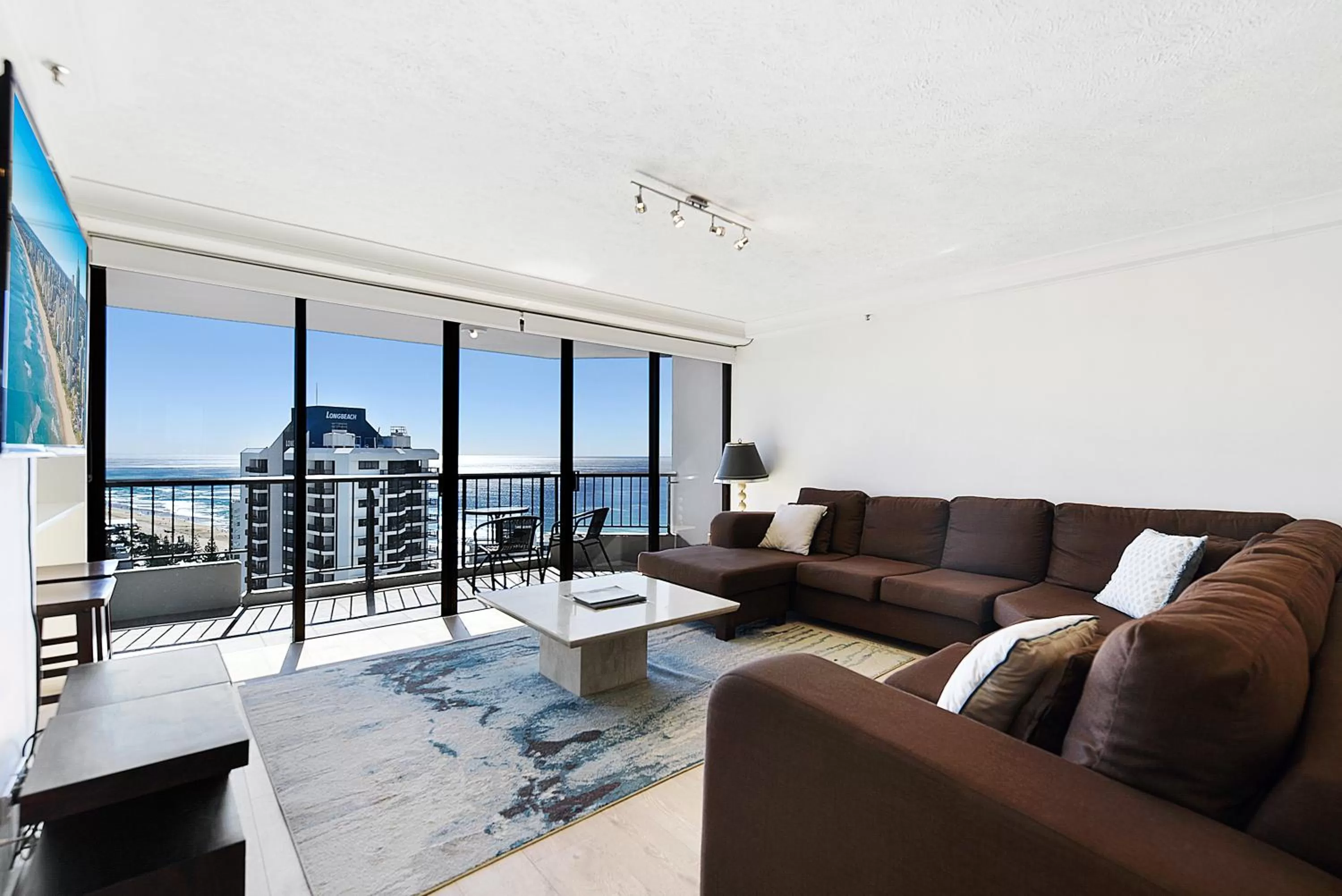 Living room in Surfers Century Oceanside Apartments