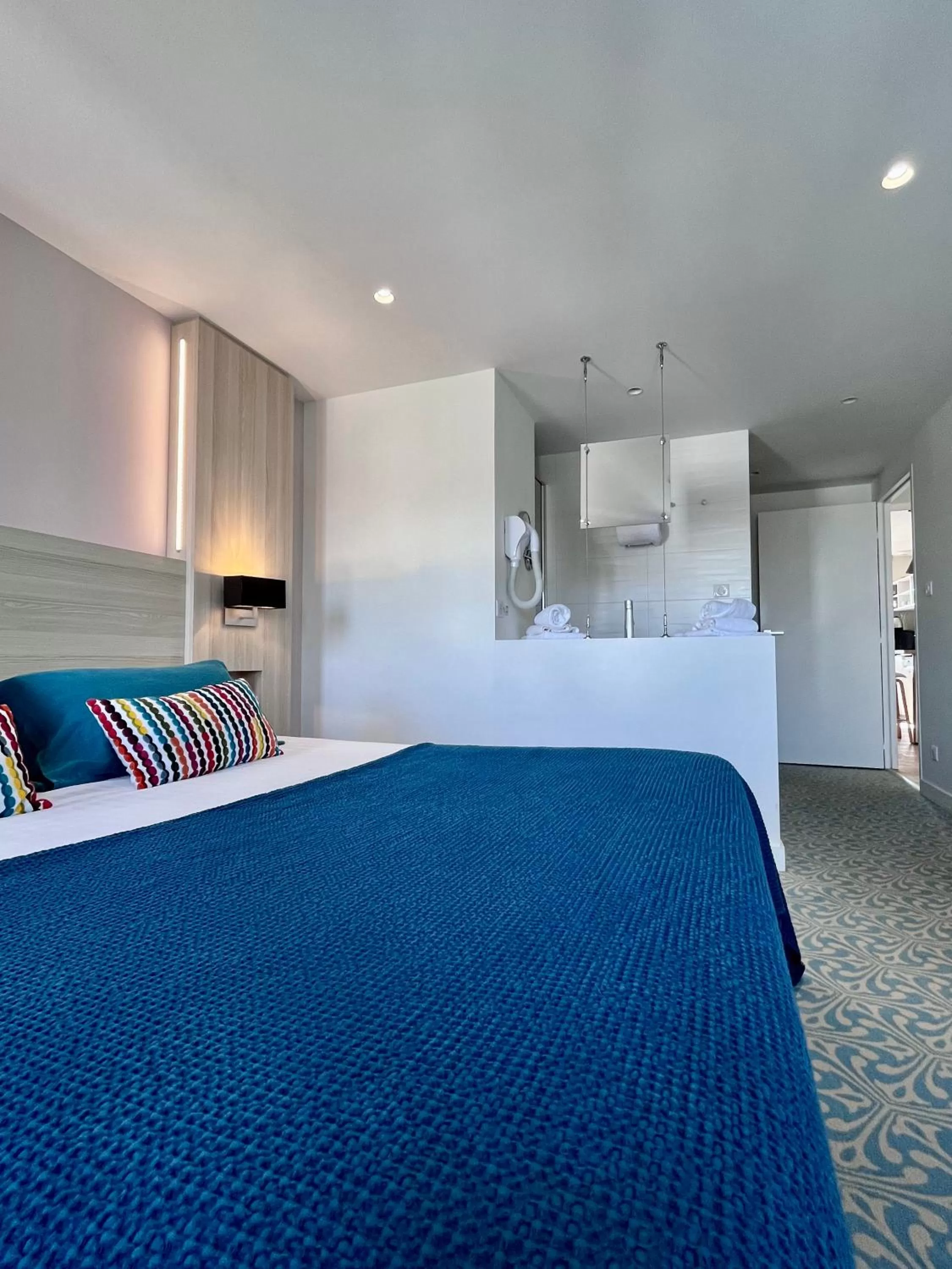 Bed in Le Cornouaille Hotel & Spa