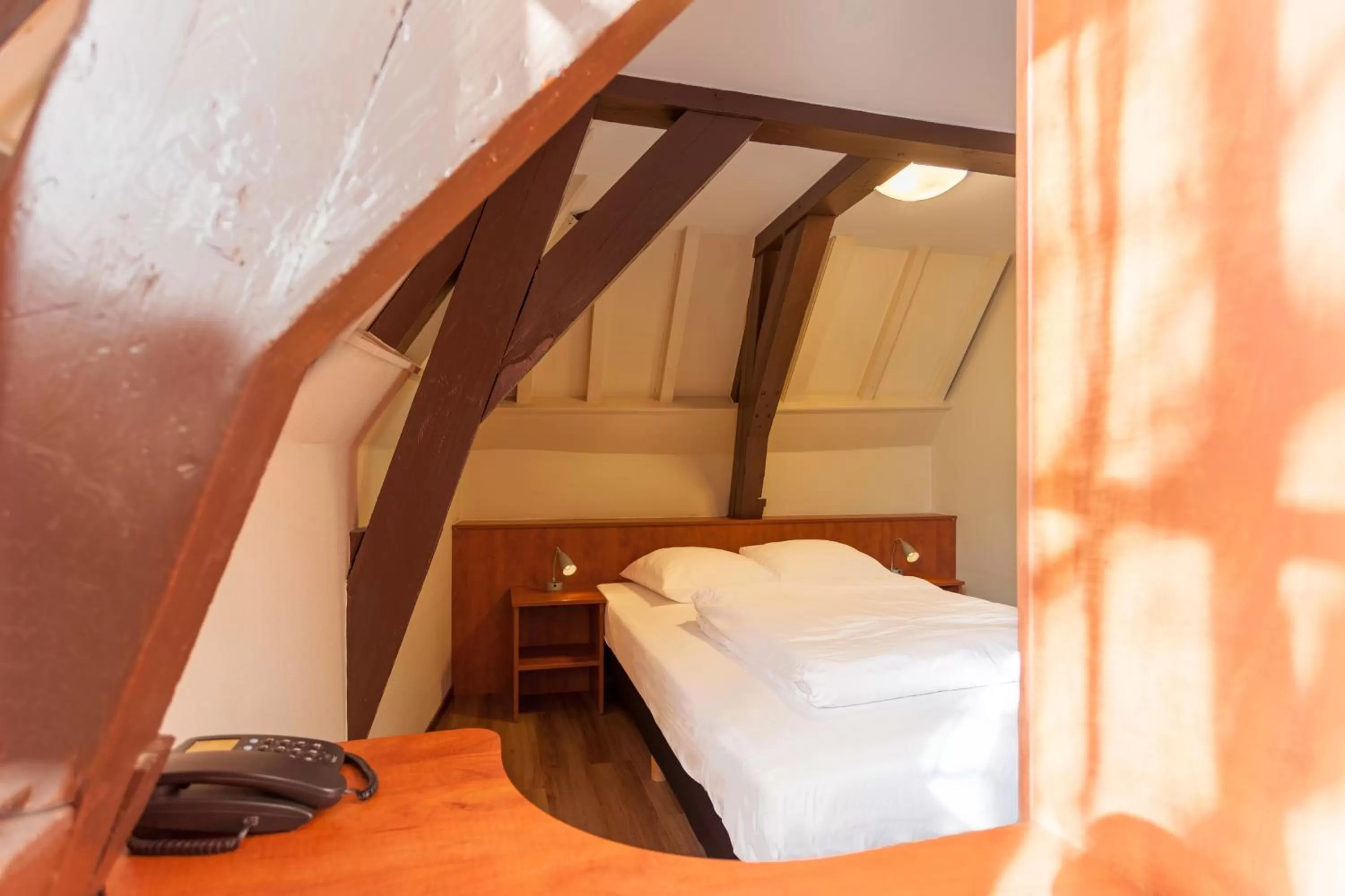 Bed in A-Train Hotel