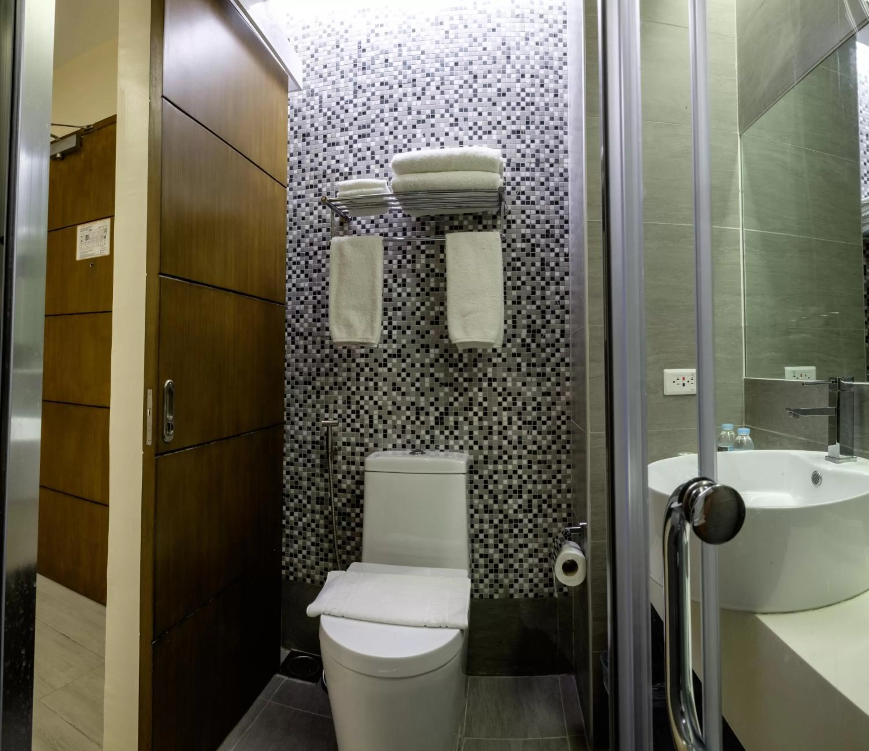 Toilet in One Central Hotel & Suites
