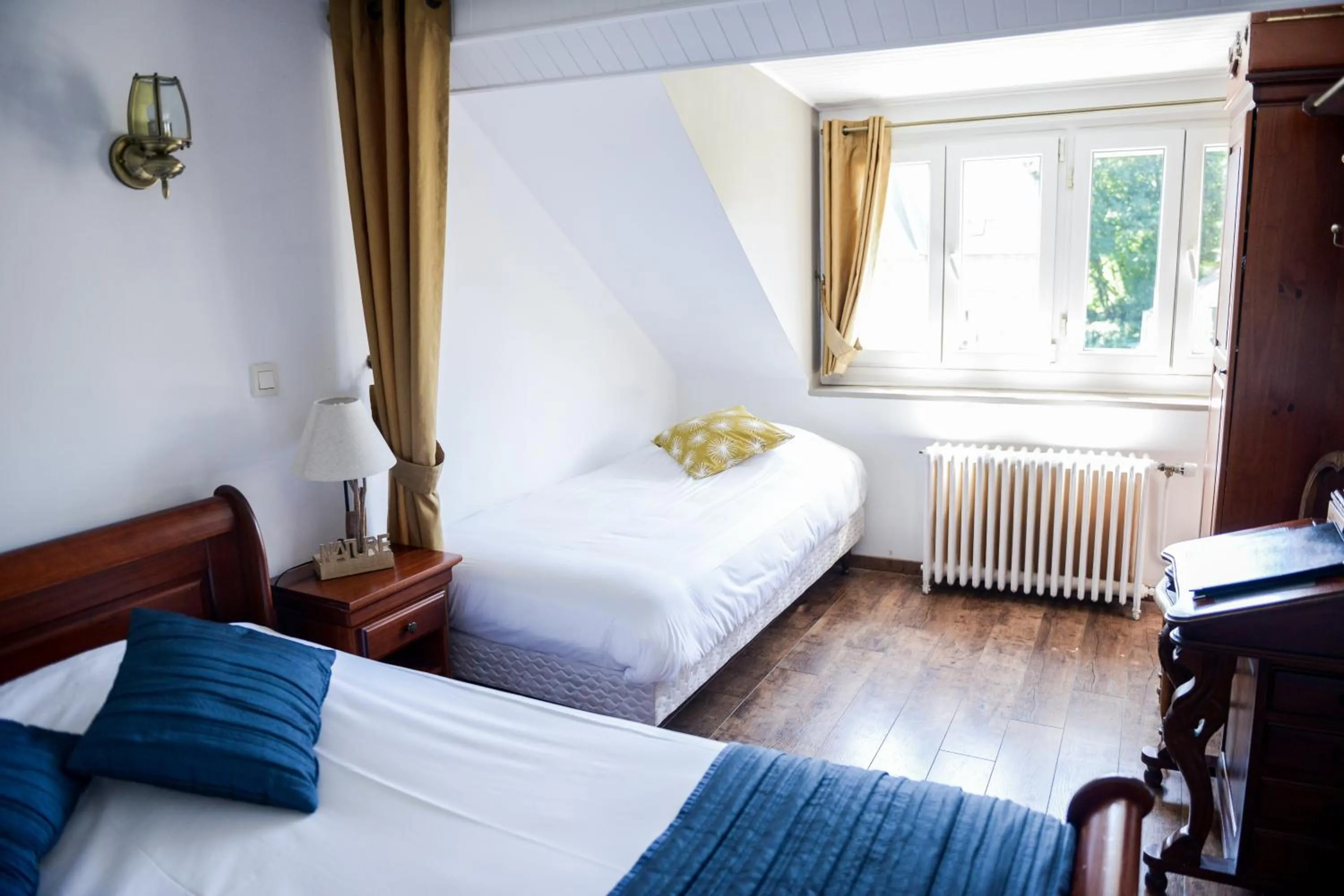 Bed in Logis Le Saint Hubert