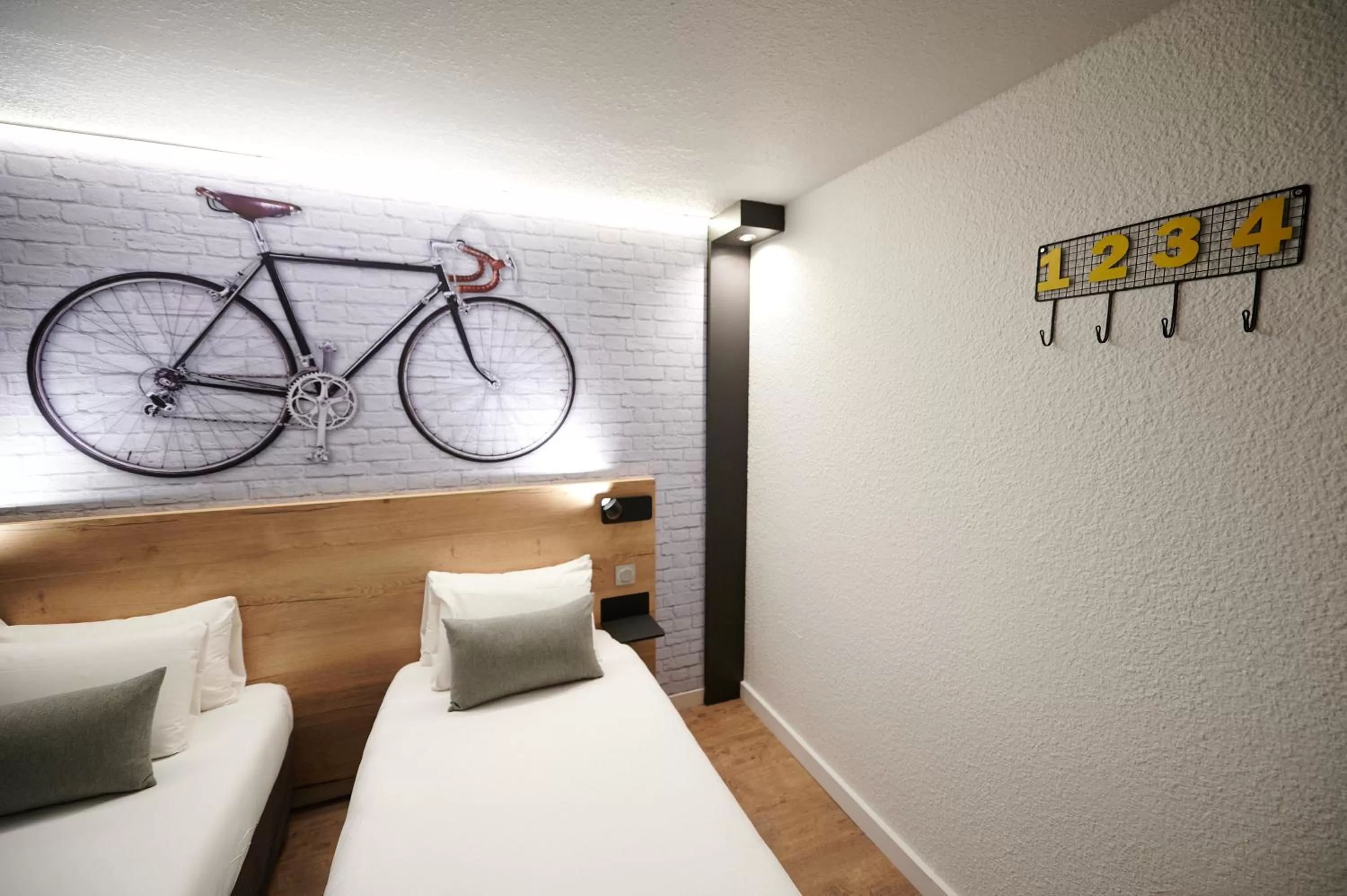 Bed in Kyriad Hotel Laval