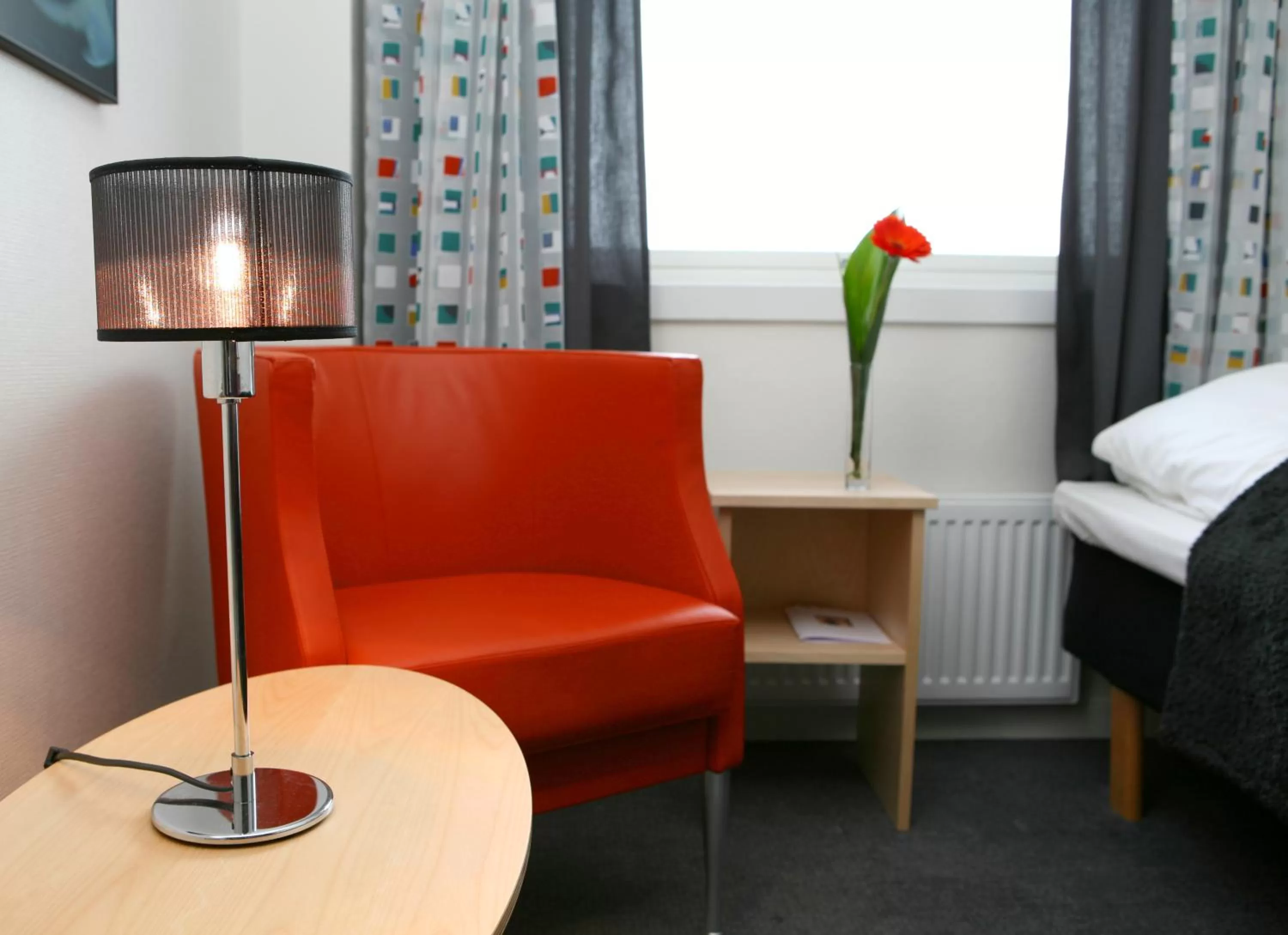 Seating area, Bed in Breidablikk Guesthouse