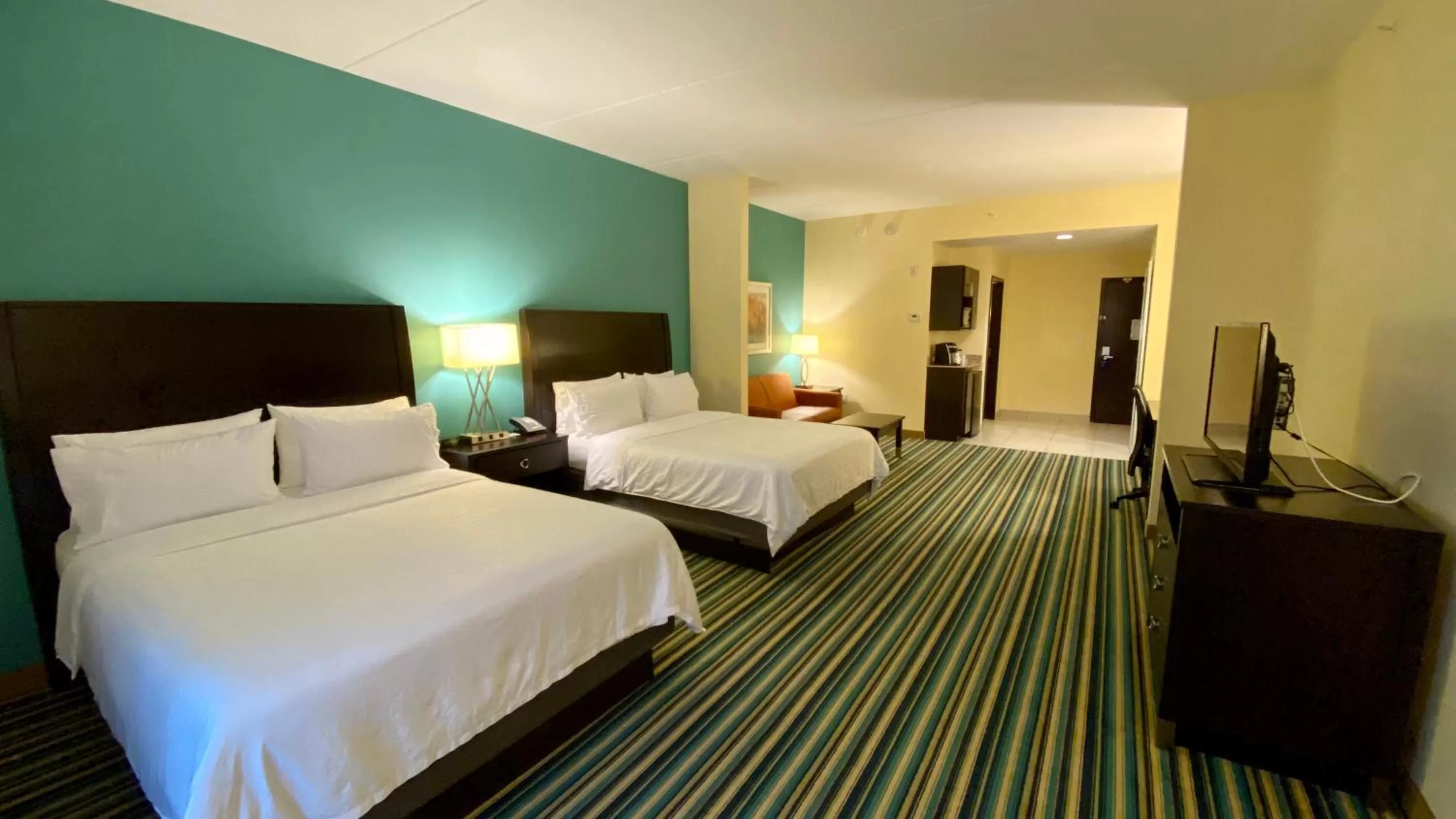 Photo of the whole room, Bed in Holiday Inn Express Hotel & Suites Orlando East-UCF Area by IHG