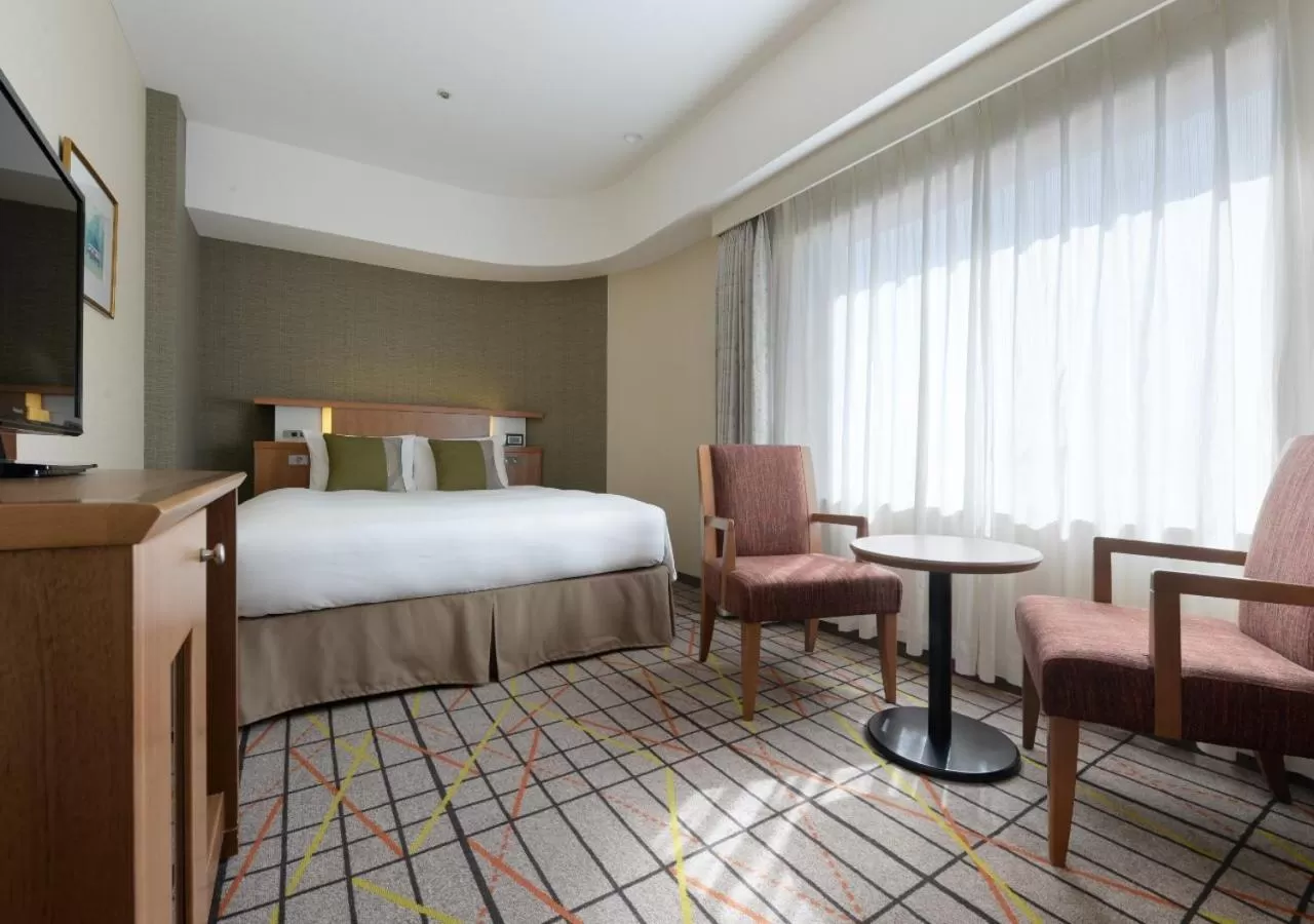 Bed in Hotel Metropolitan Tokyo Ikebukuro