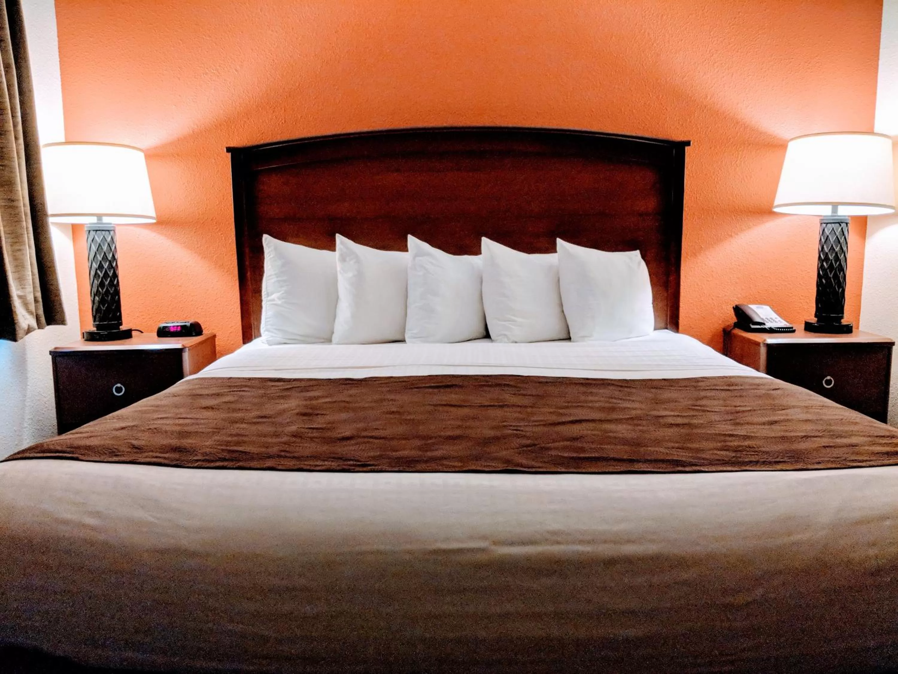 Bed in AmericInn by Wyndham Grand Forks