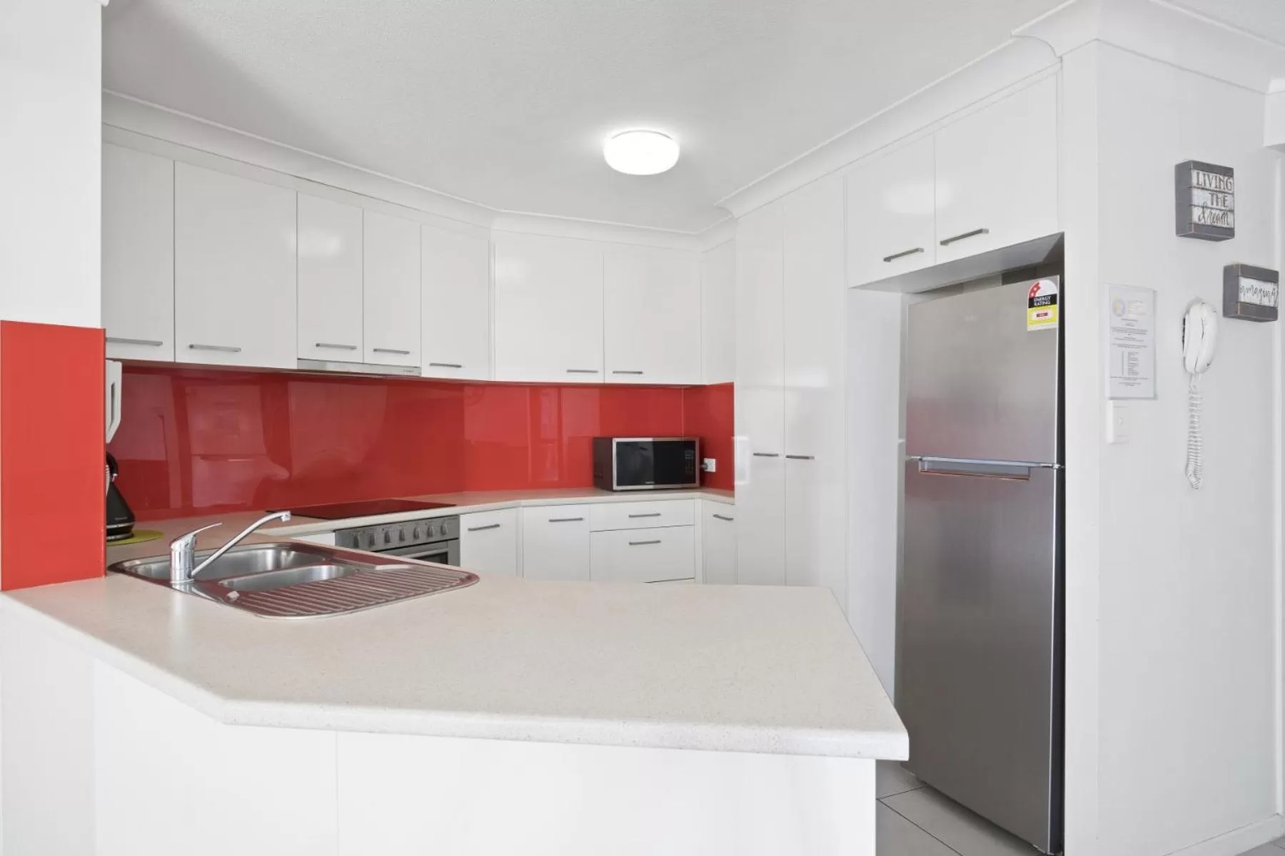 Kitchen or kitchenette in Kirra Palms Holiday Apartments