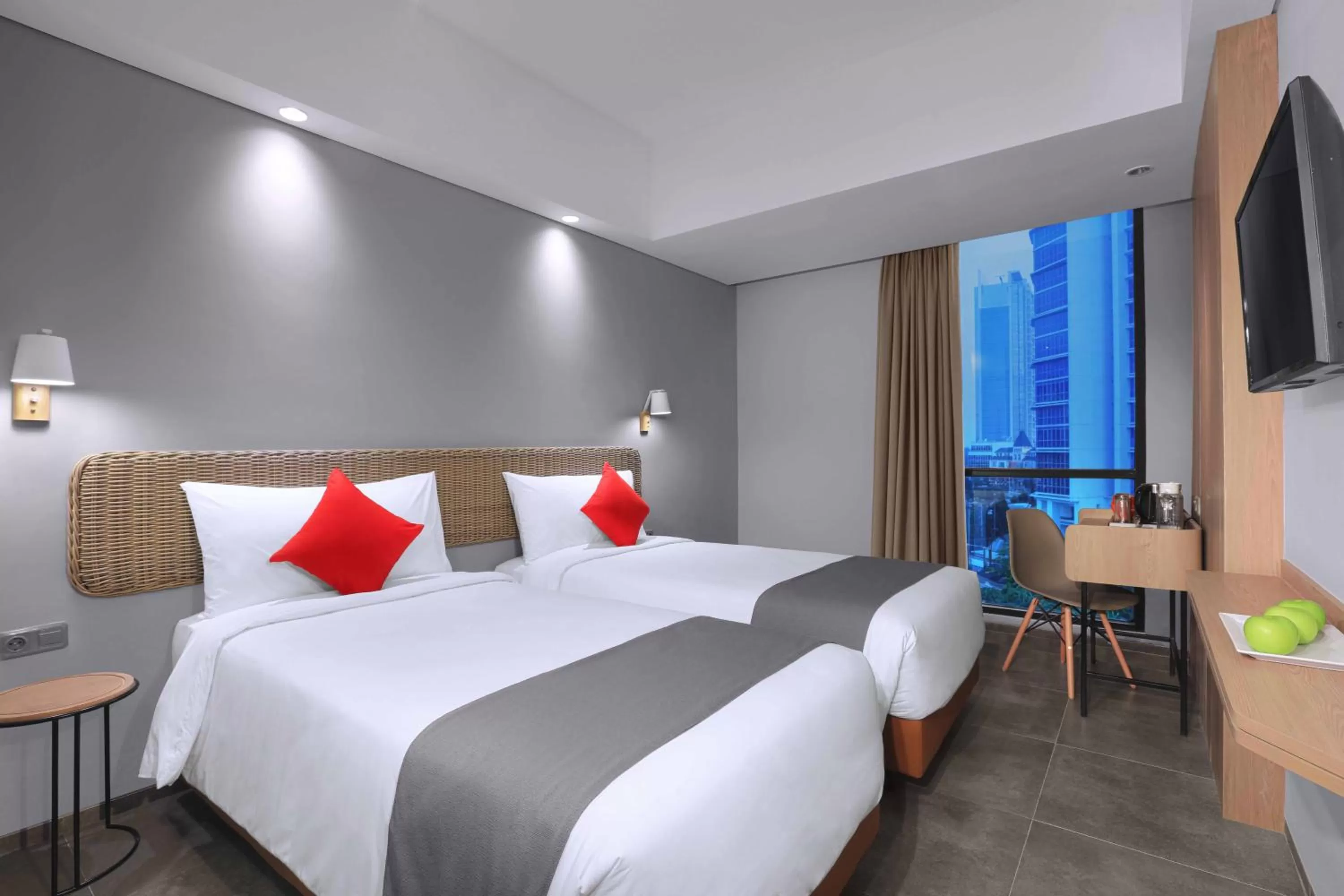 Bed in Neo Hotel Puri Indah