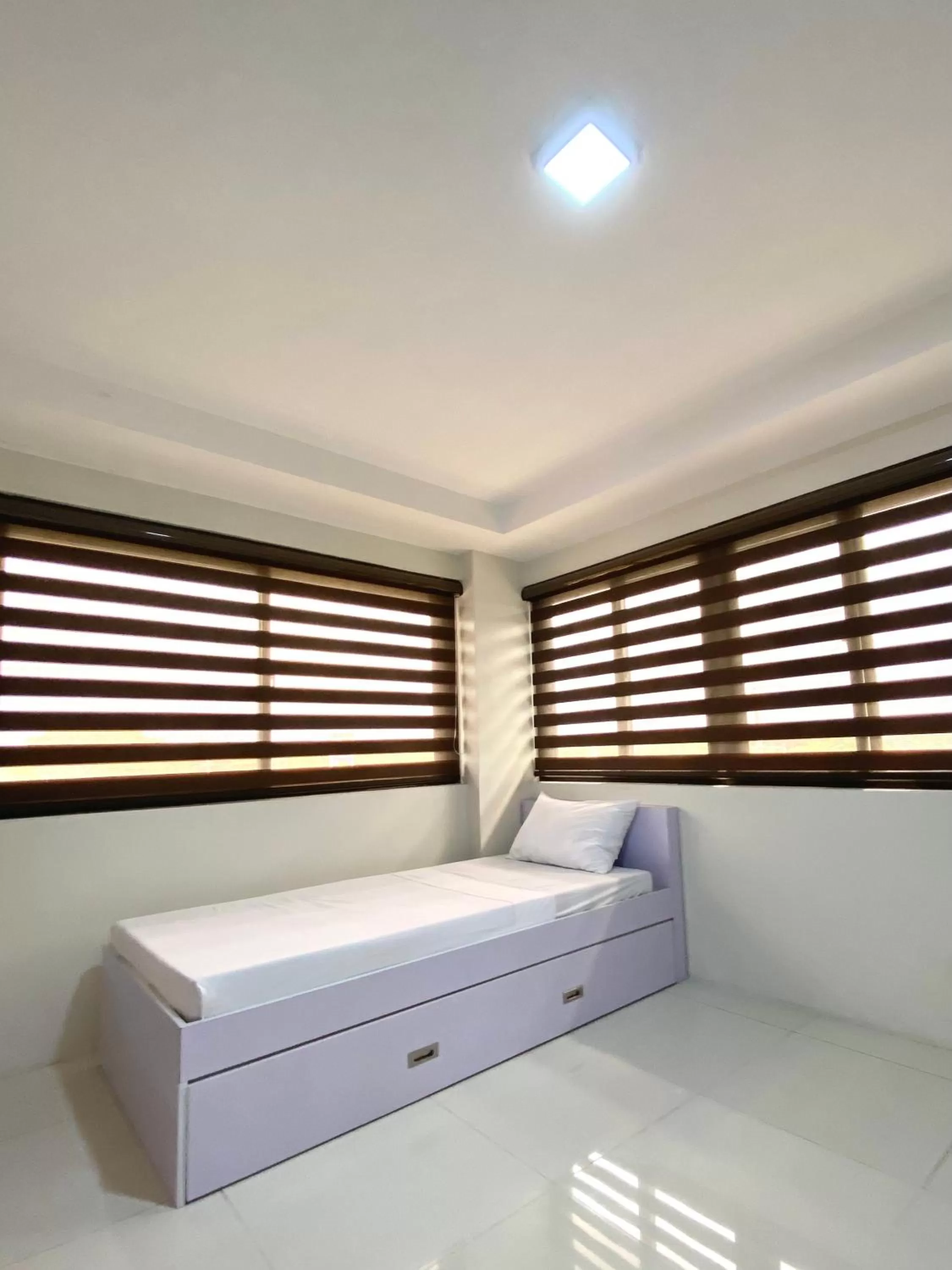 Bed in Staycation Hotel