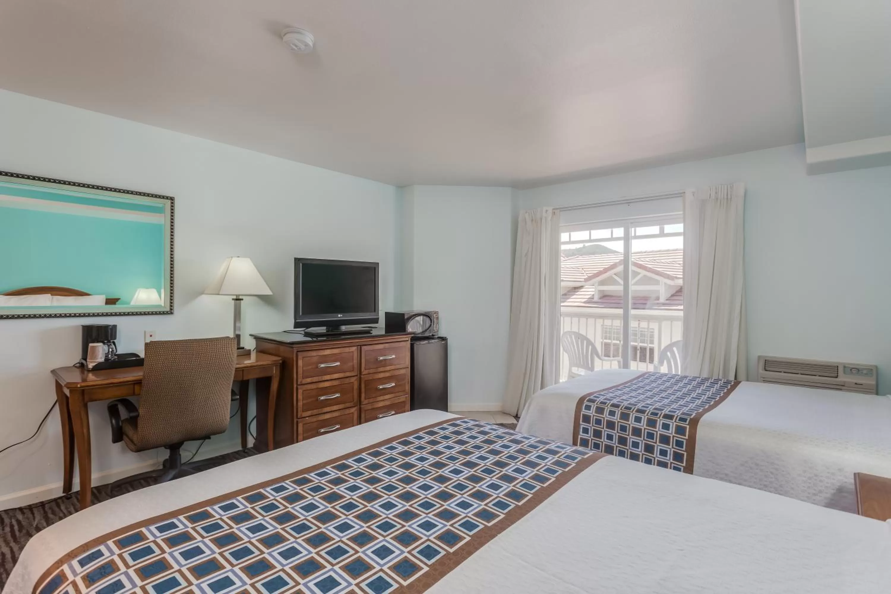 Bed in Pacifica Beach Hotel