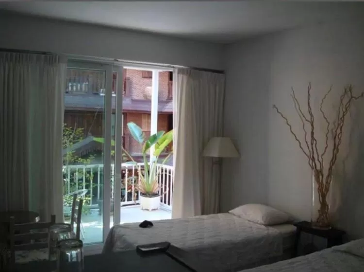 Bed in Oriental Smile Hotel