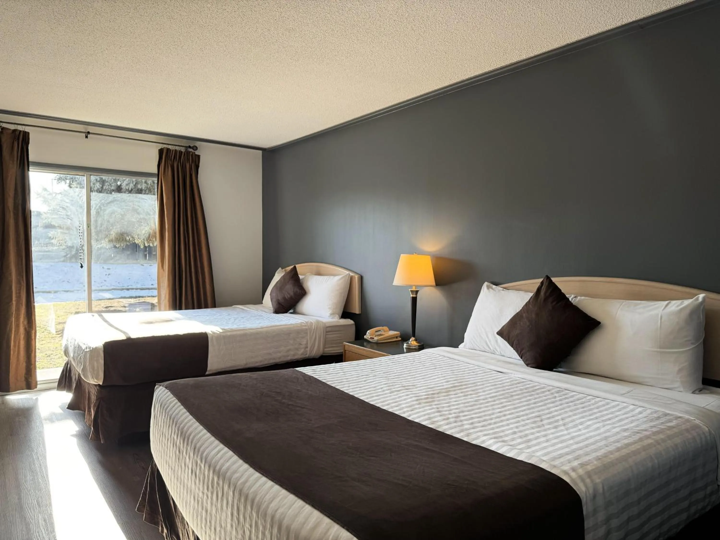 Bed in Divya Sutra Plaza and Conference Centre, Vernon, BC