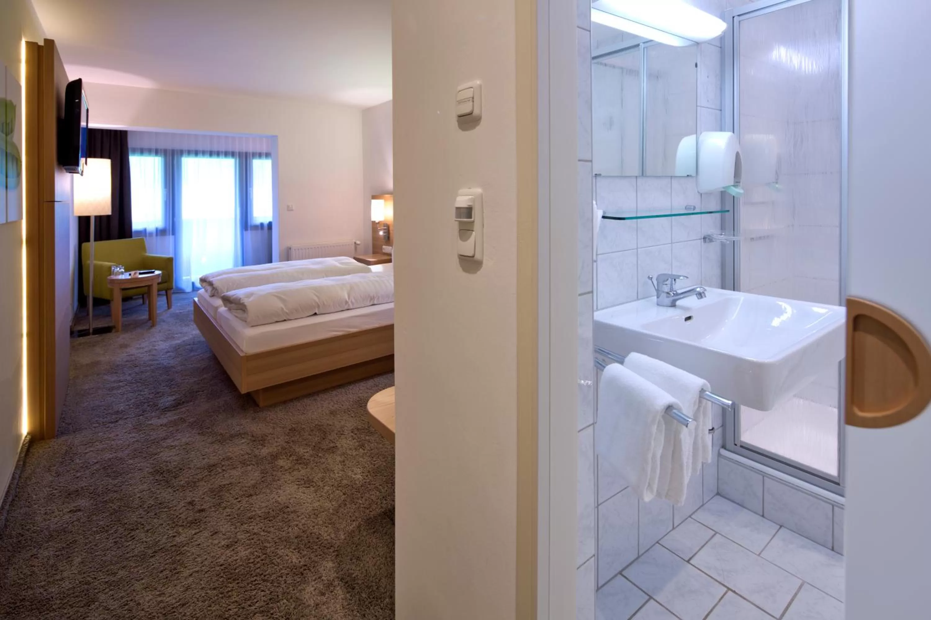 Bathroom, Bed in Geniesserhotel Alpin GmbH