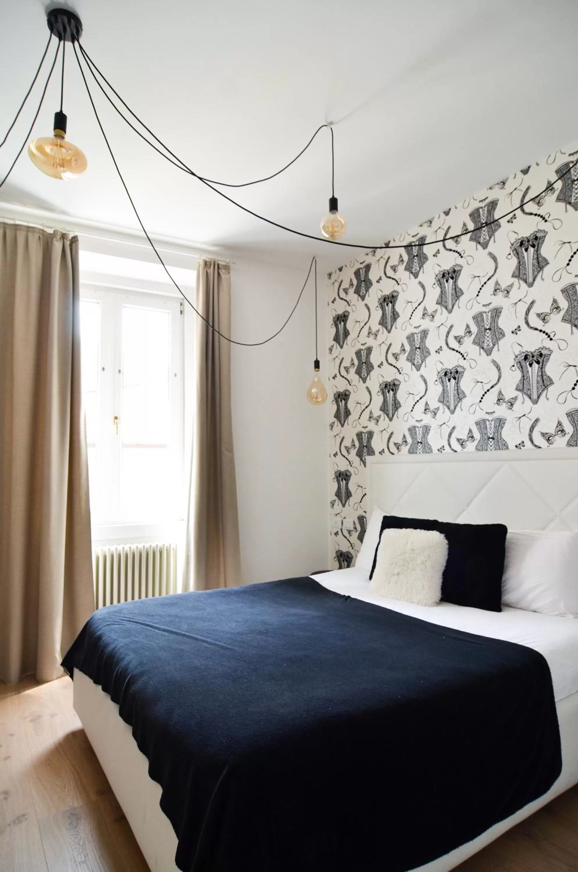 Bed in Lainez Rooms & Suites