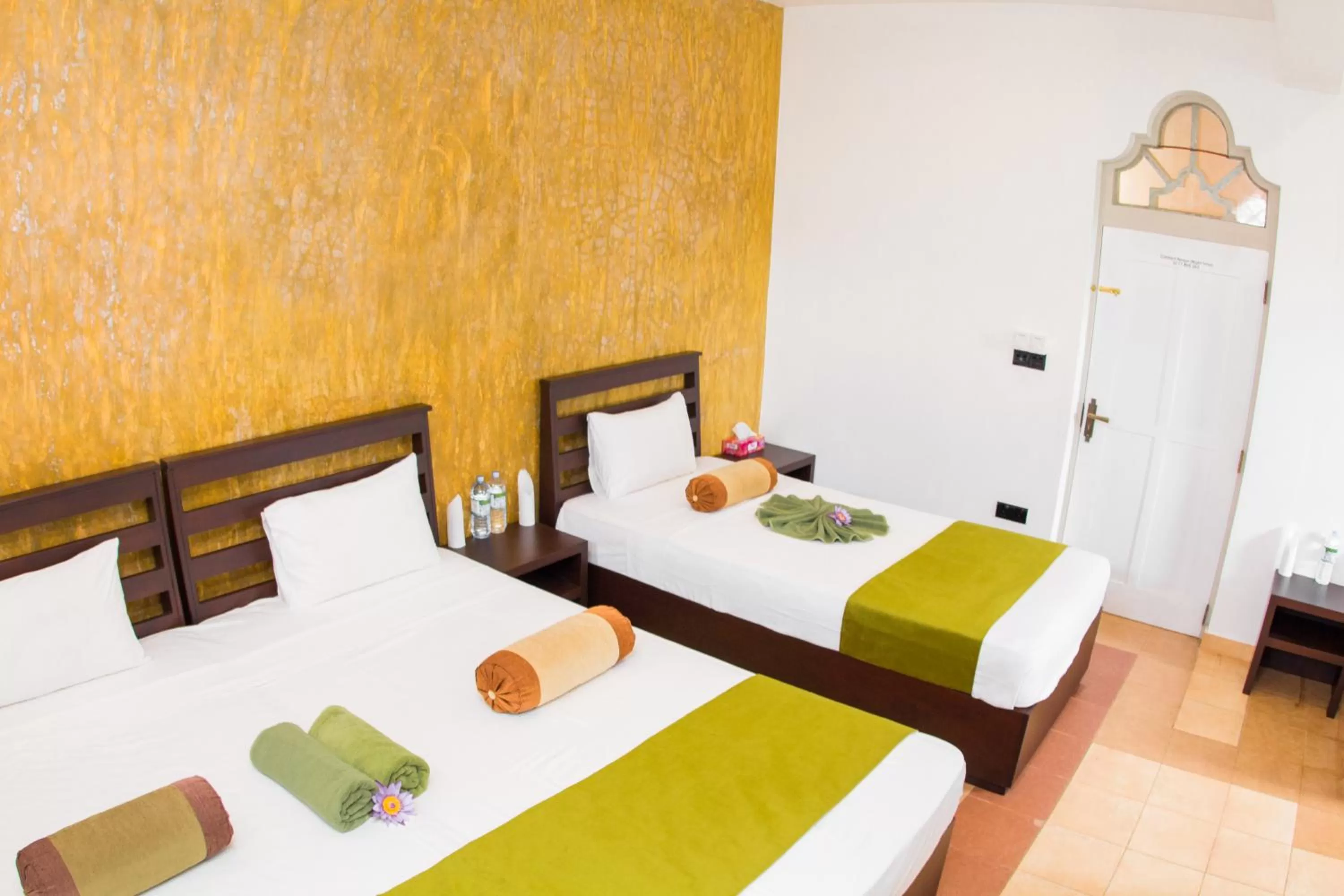 Bed in Jasmin Villa Ayurveda Resort