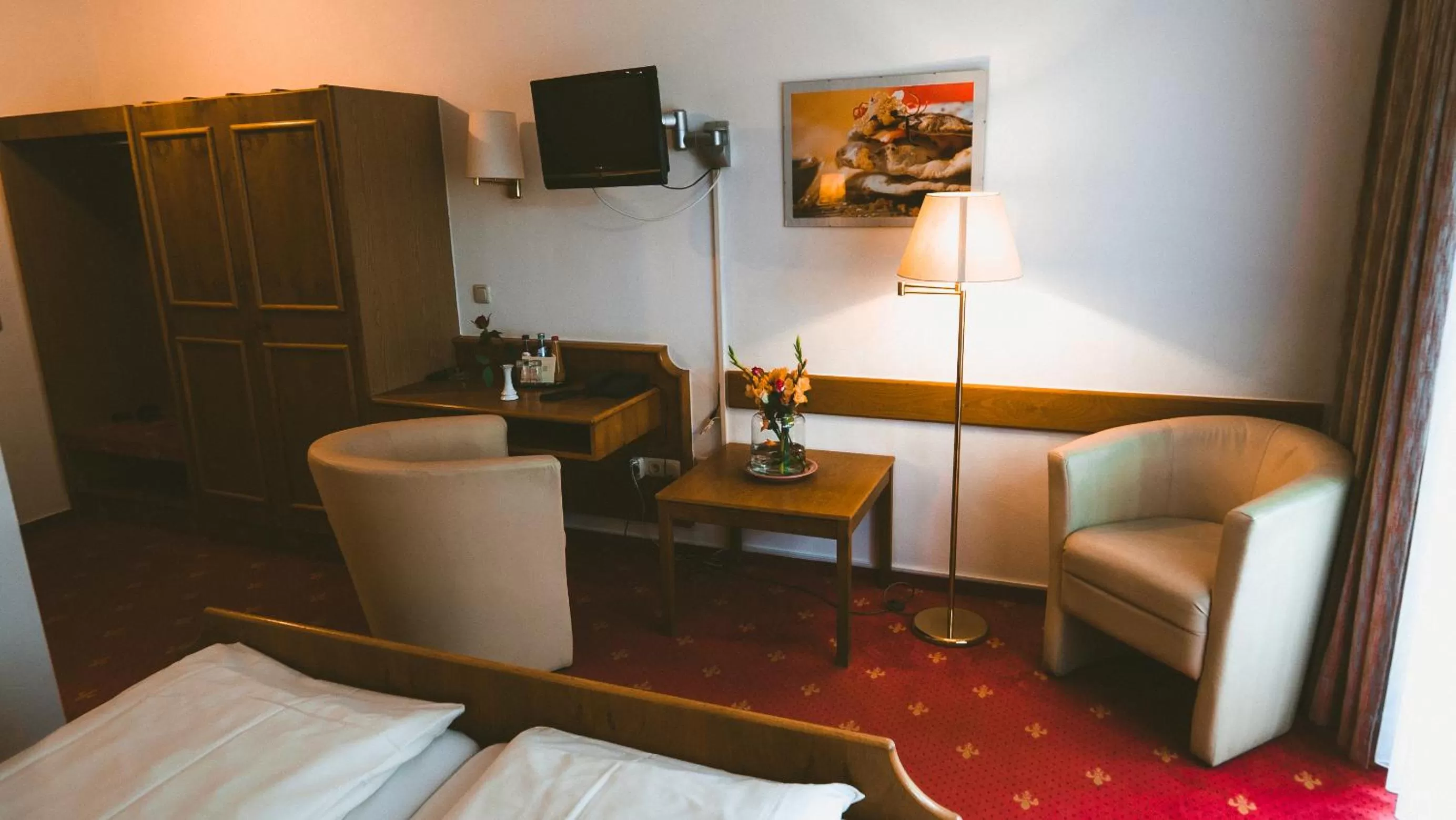 Seating area, Bed in Hotel Büchner Garni