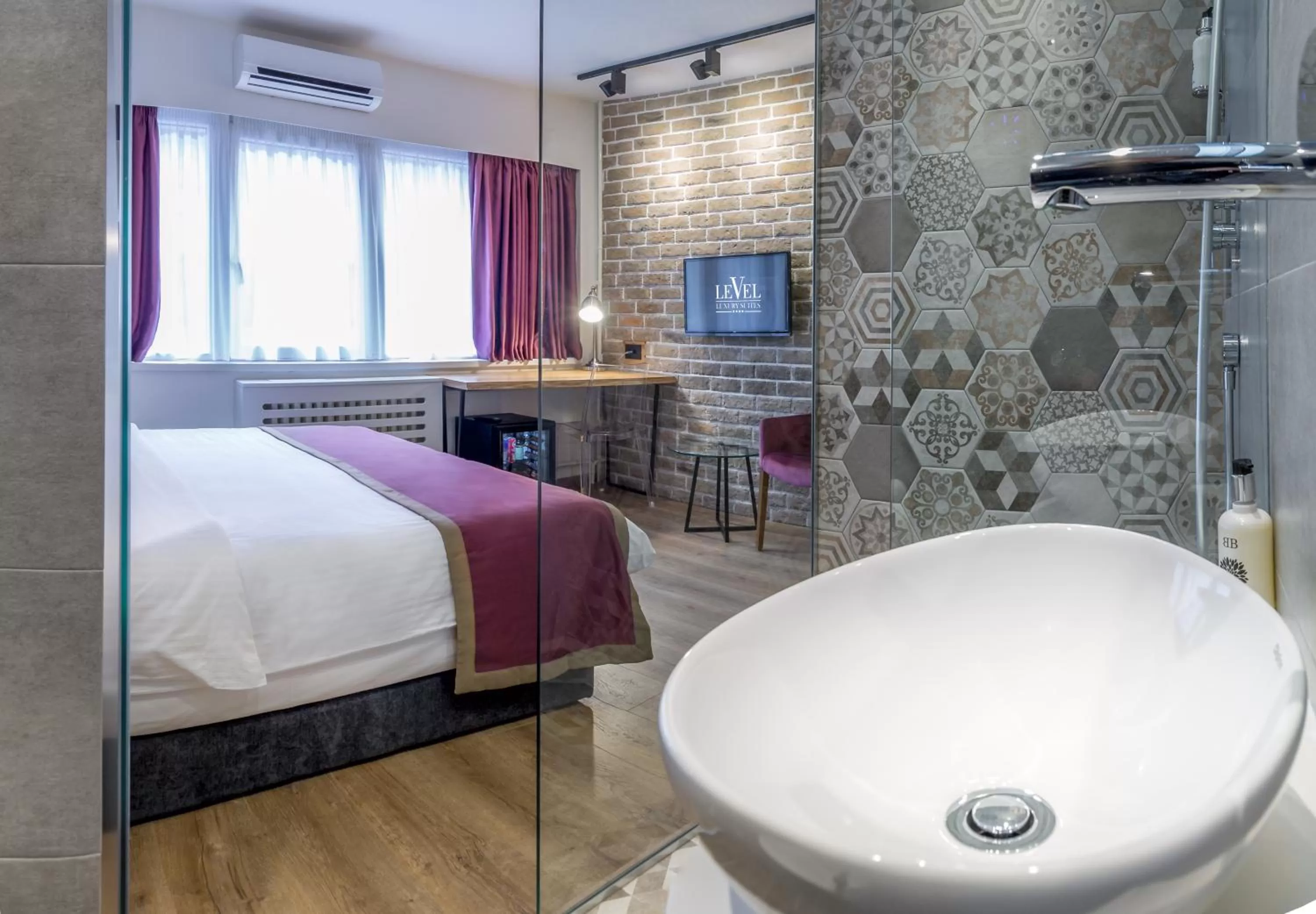 Bathroom, Bed in Level Luxury Suites