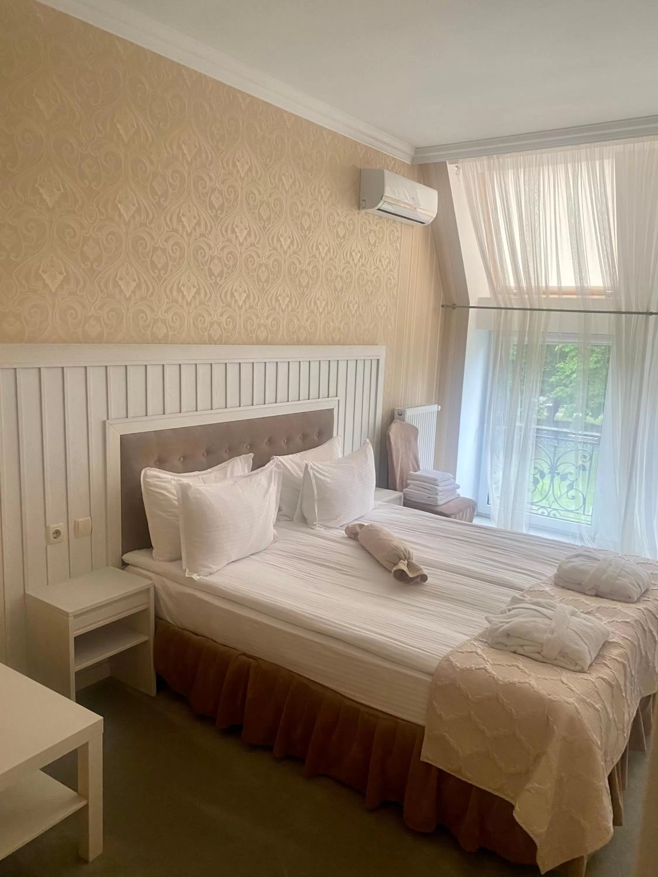 Bed in Boutique Hotel Deluxe