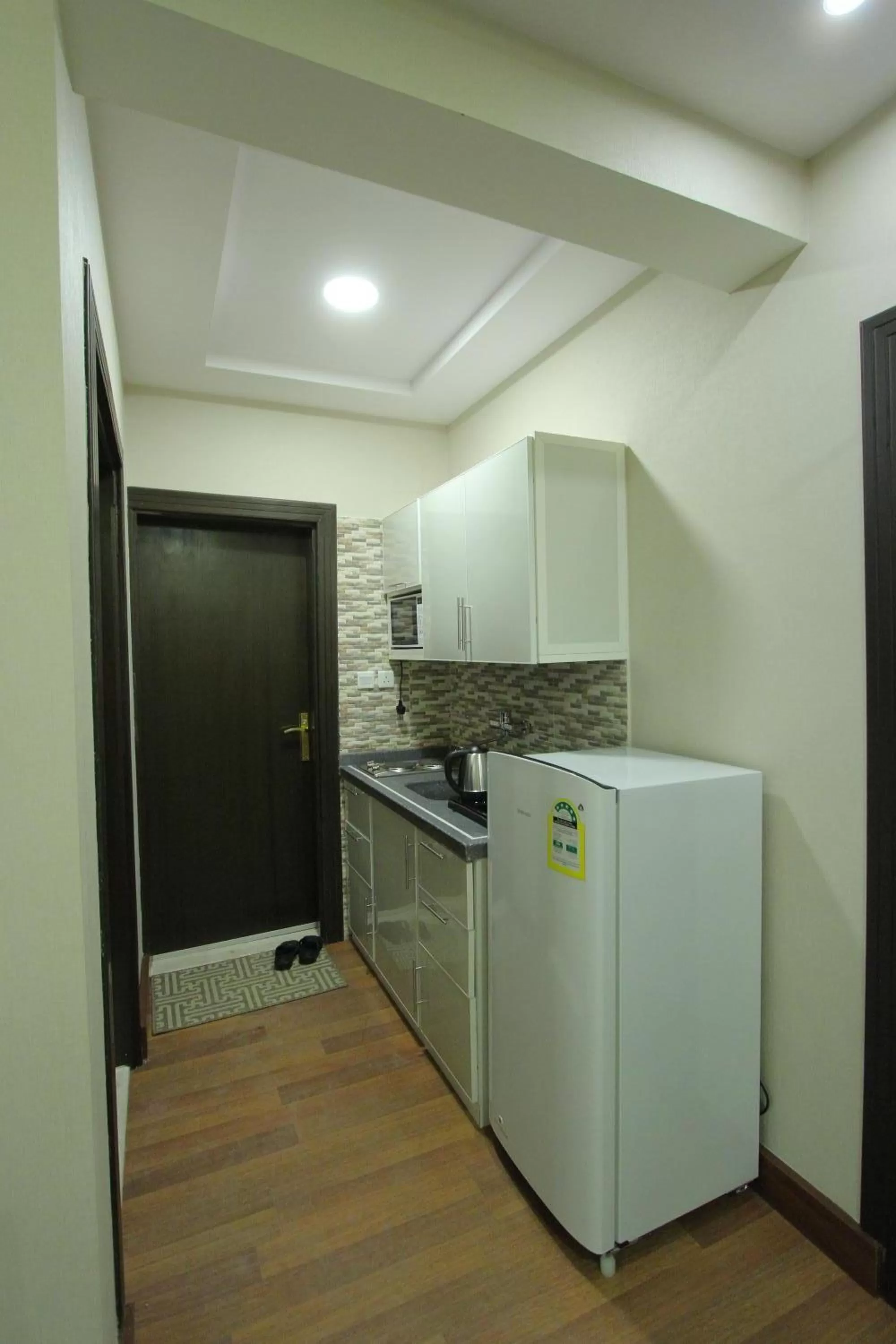Kitchen or kitchenette in Qasr Rayana Aparthotel