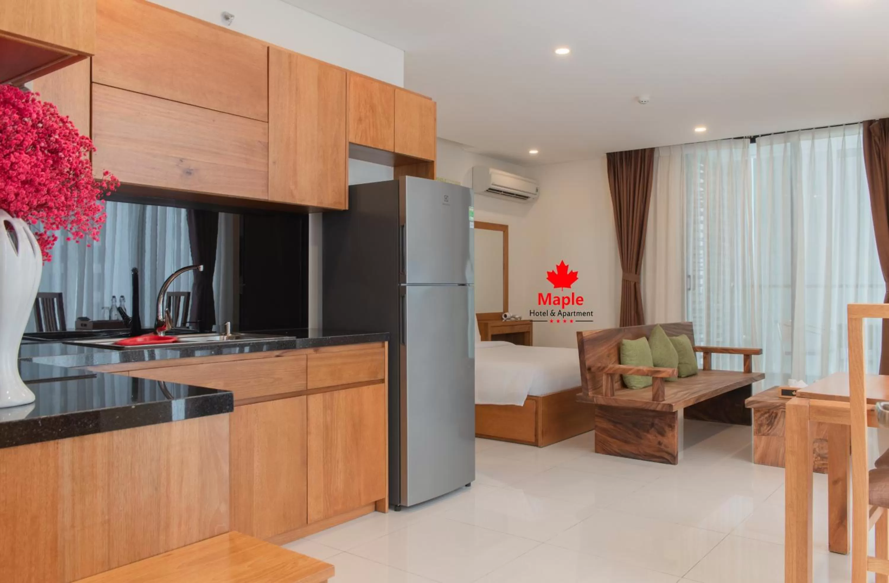 stove in Maple Hotel & Apartment