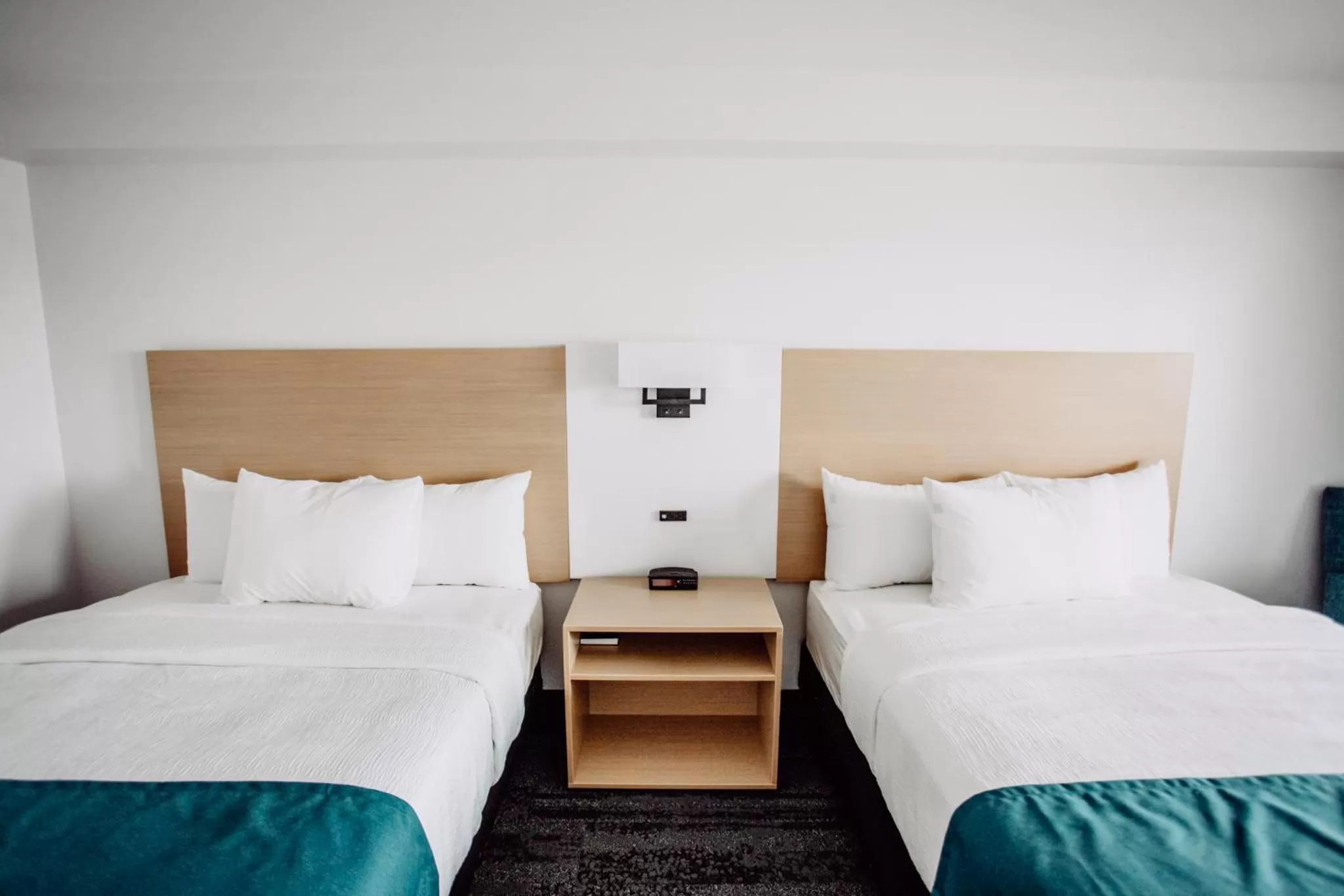 Bed in La Place Rendez-Vous Hotel