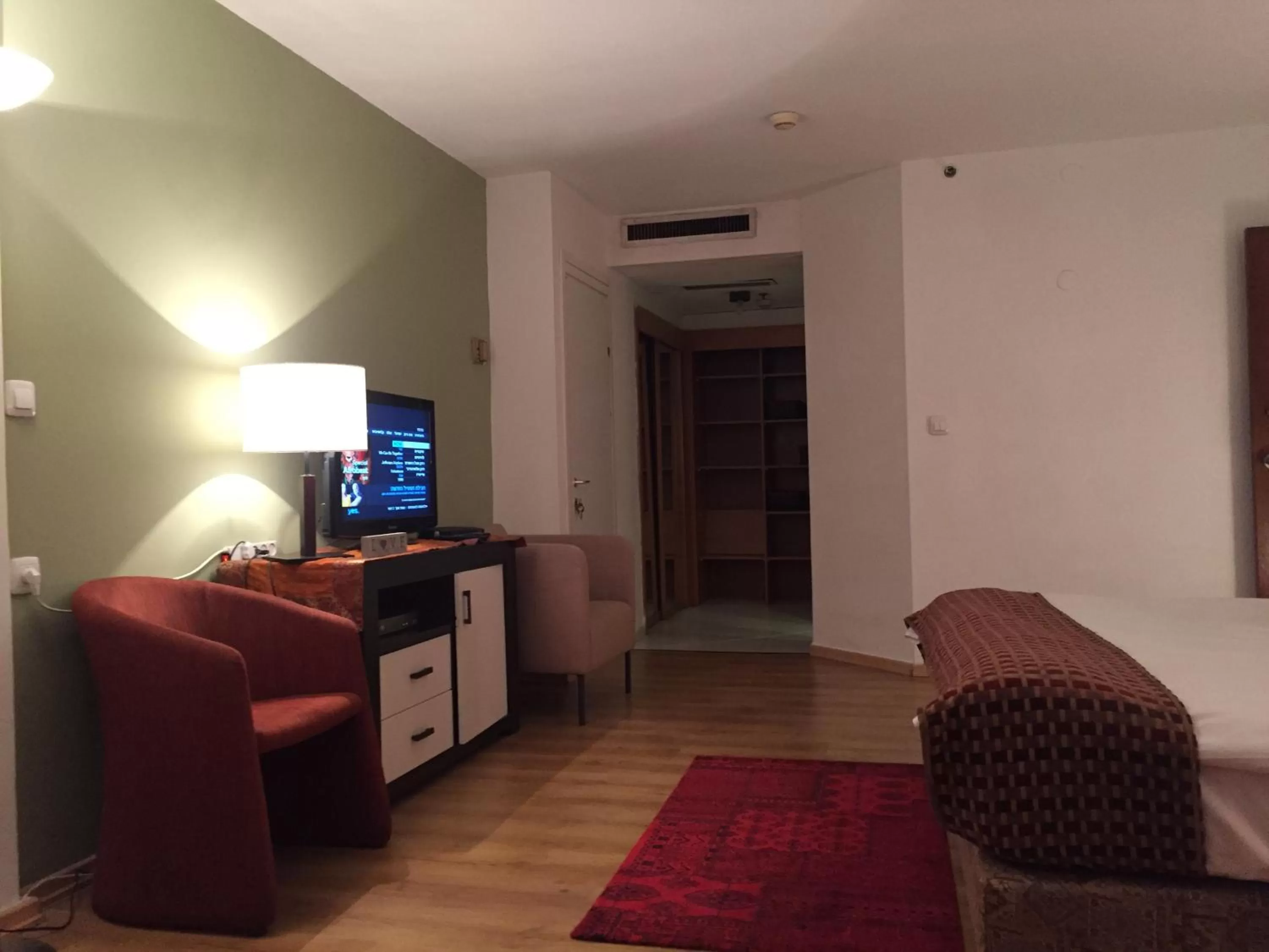 Bedroom, Seating Area in Raphael Apartments