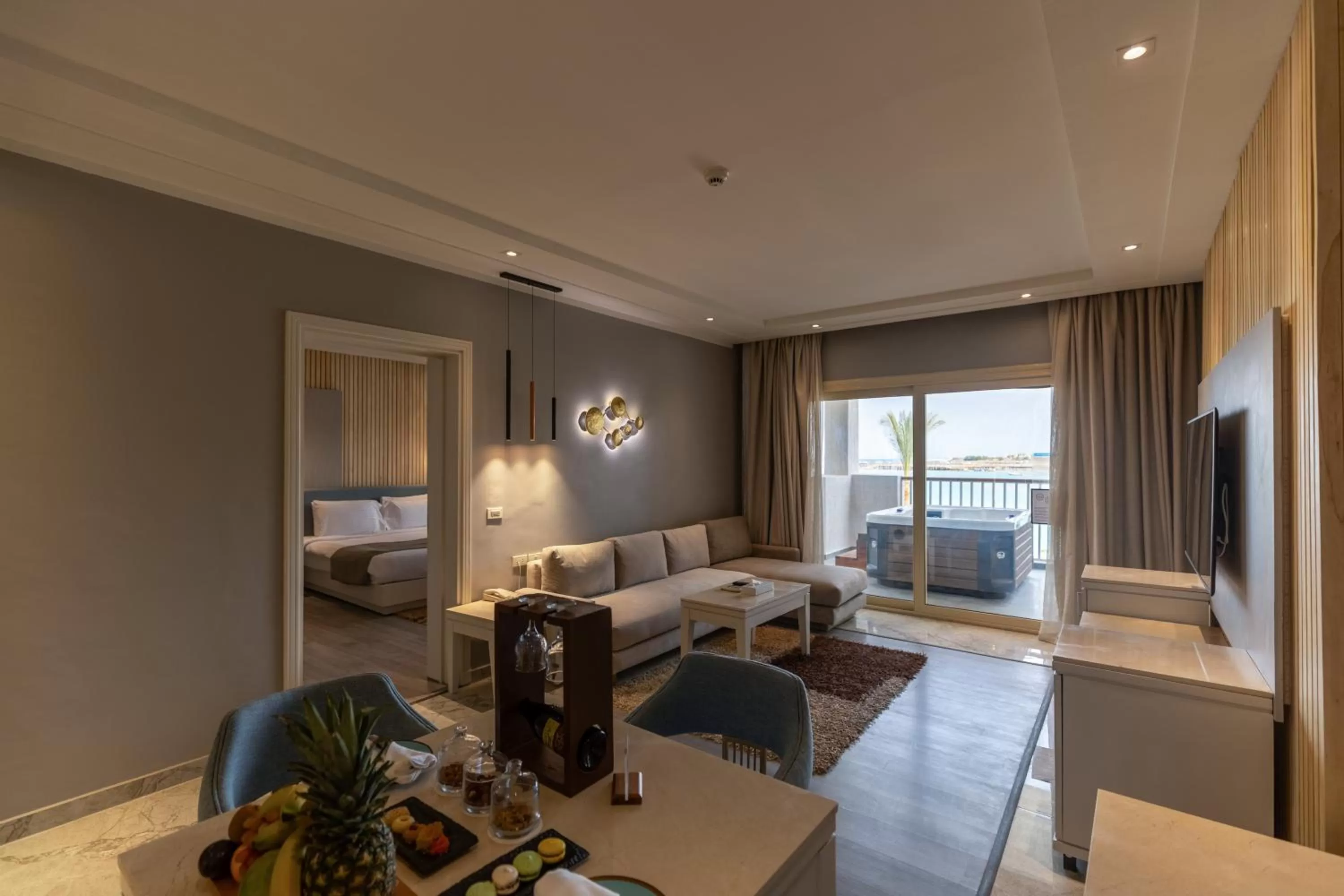 Living room, Bed in Sunrise Crystal Bay Resort -Grand Select