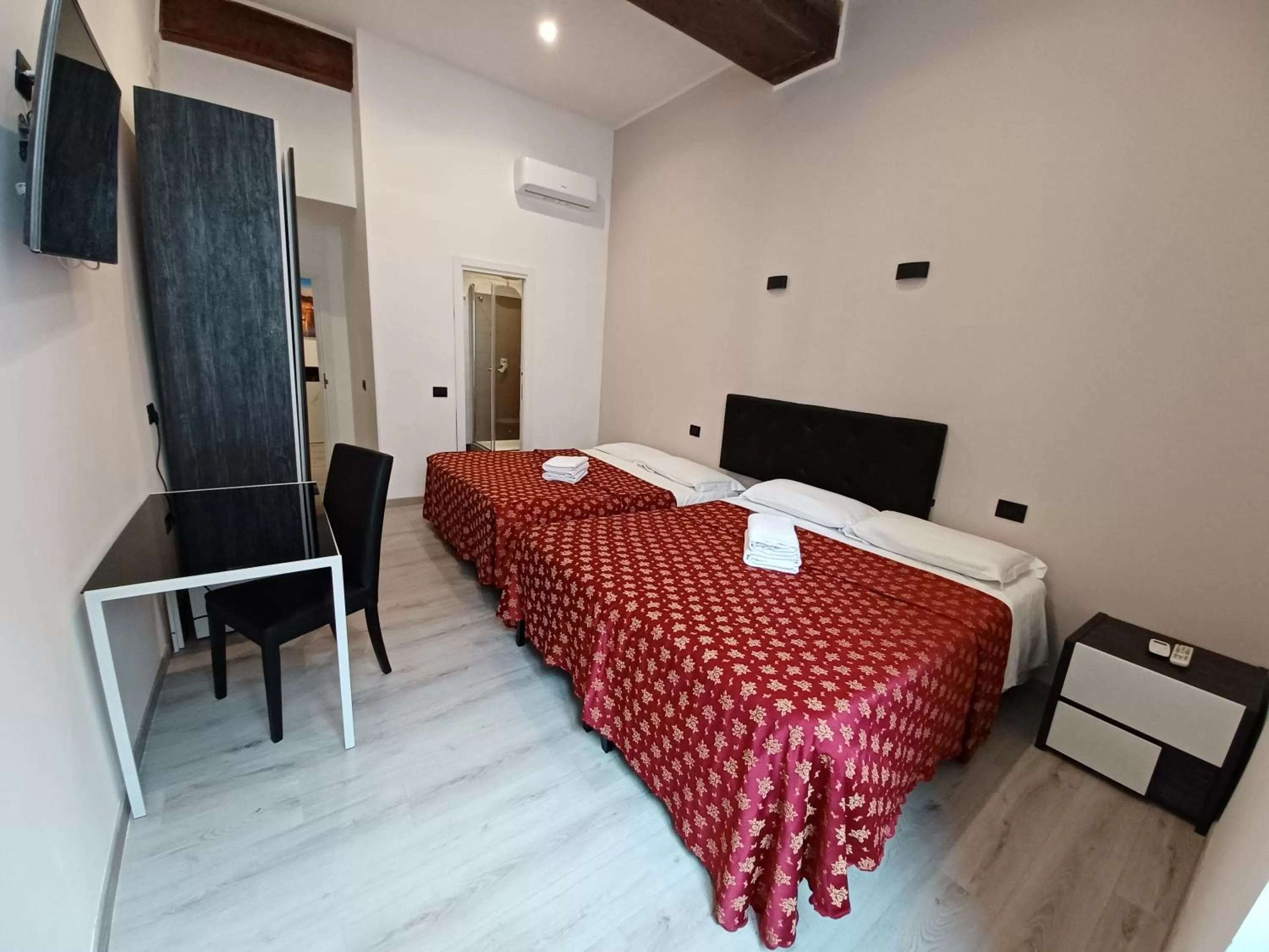 Bed in Hotel Mimosa Pantheon