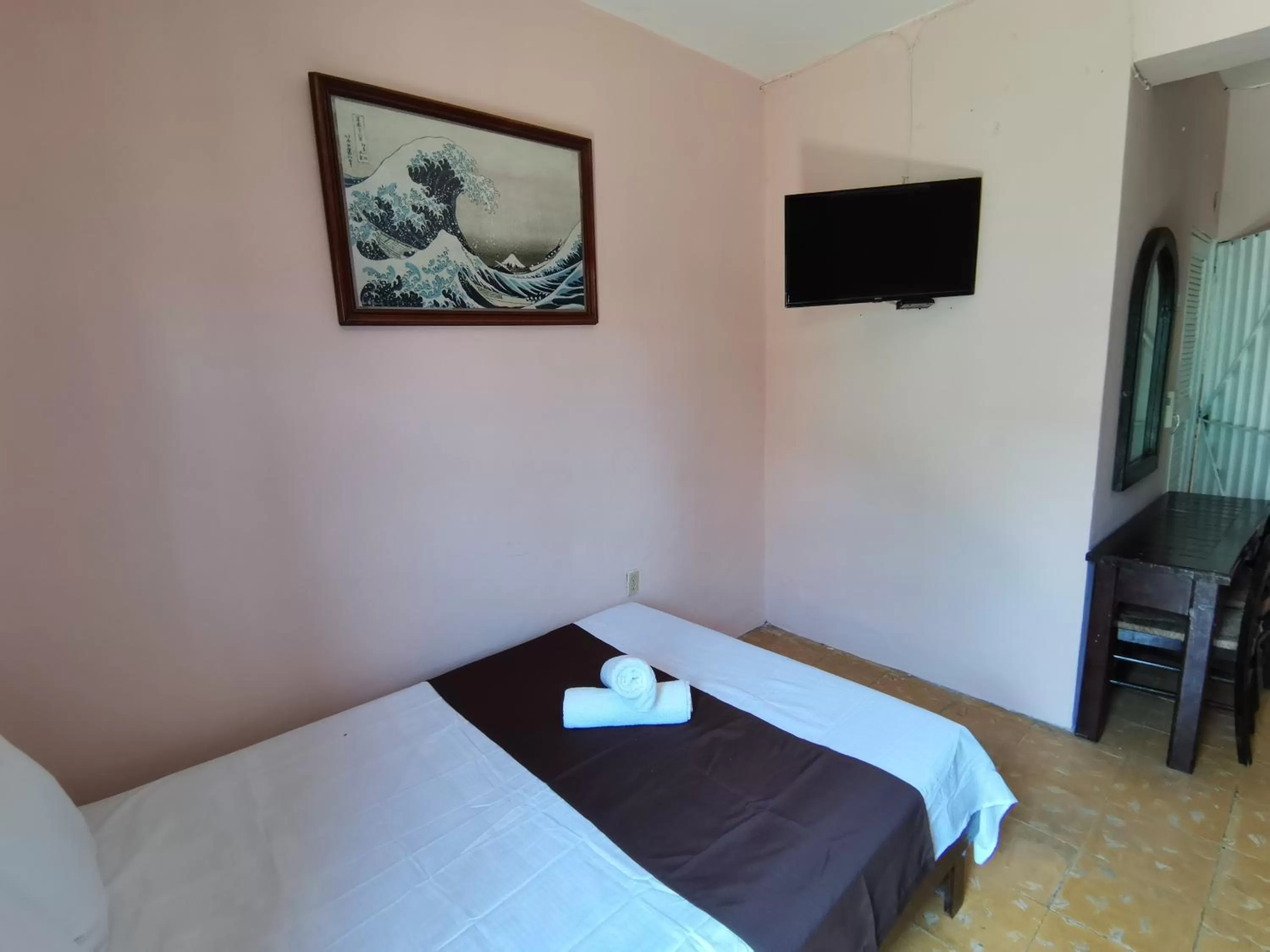 Bed in Hotel Colonial San Carlos