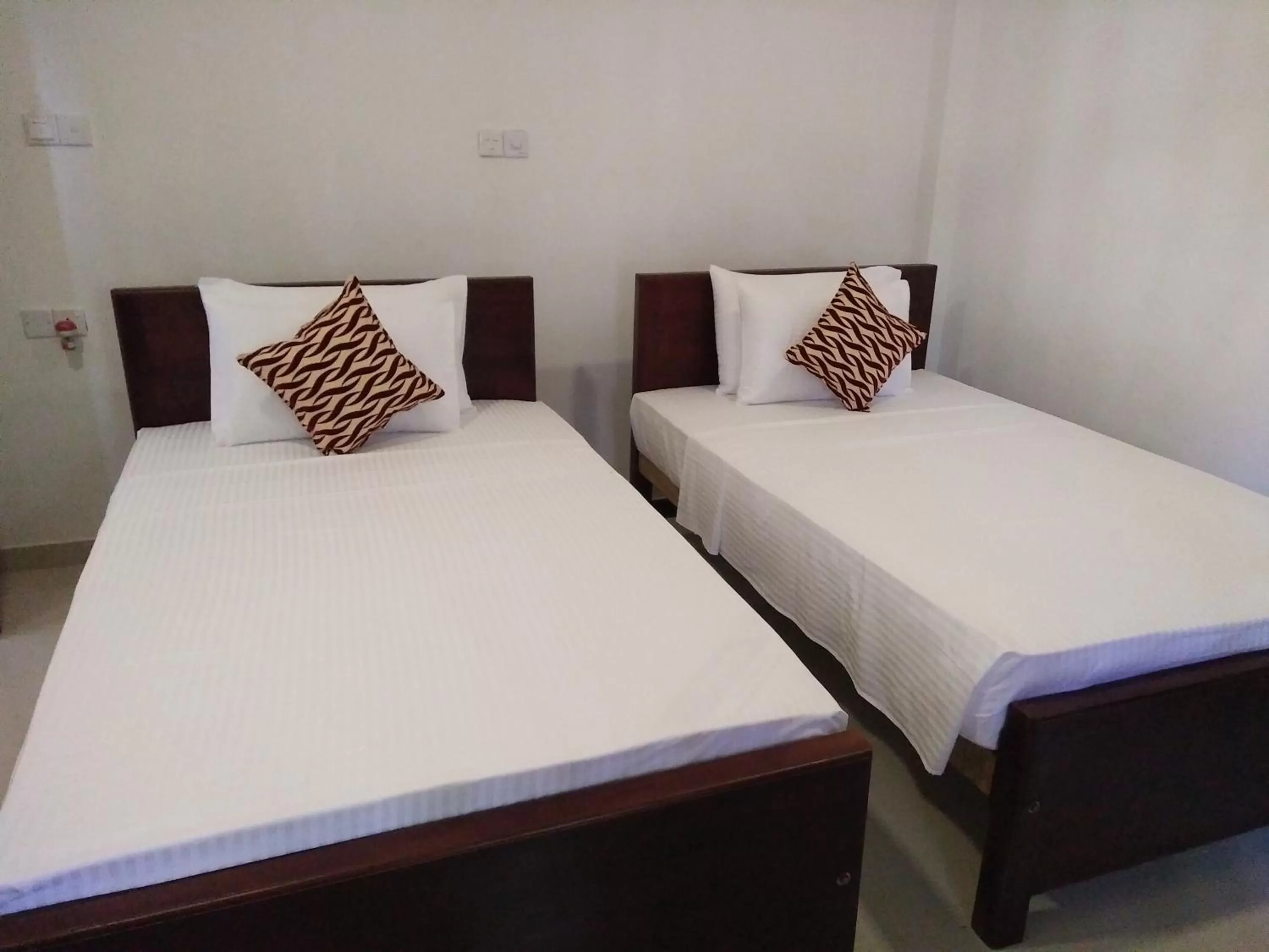 Bed in Ocean Bay Surf Resort Weligama