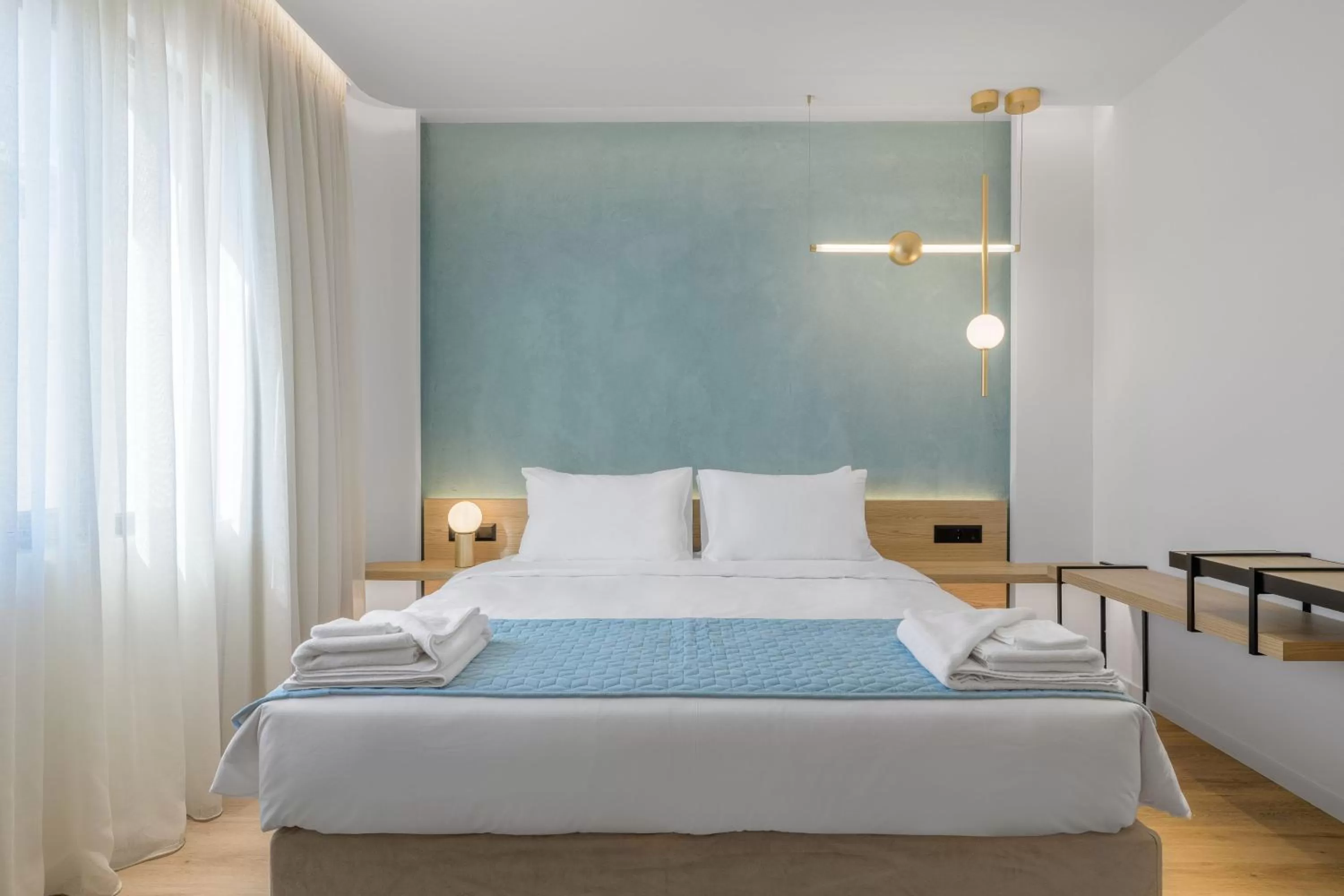 Bed in Acropolis Magenta Luxury Suites