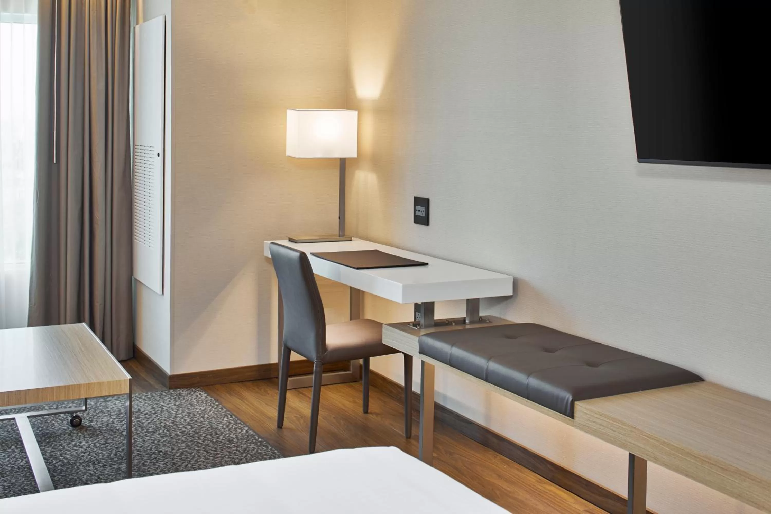 Seating area, Bed in AC Hotel by Marriott Orlando Lake Buena Vista