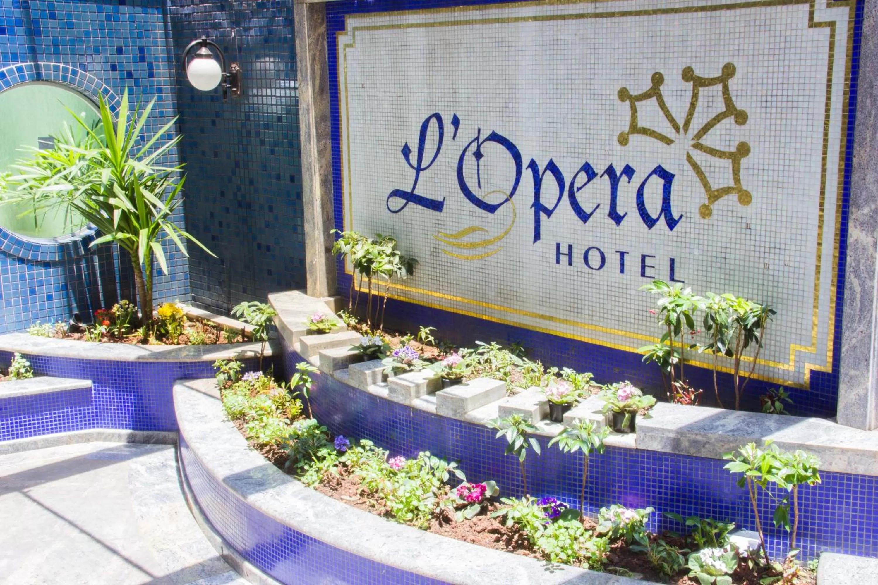 Property logo or sign in L'Opera Hotel
