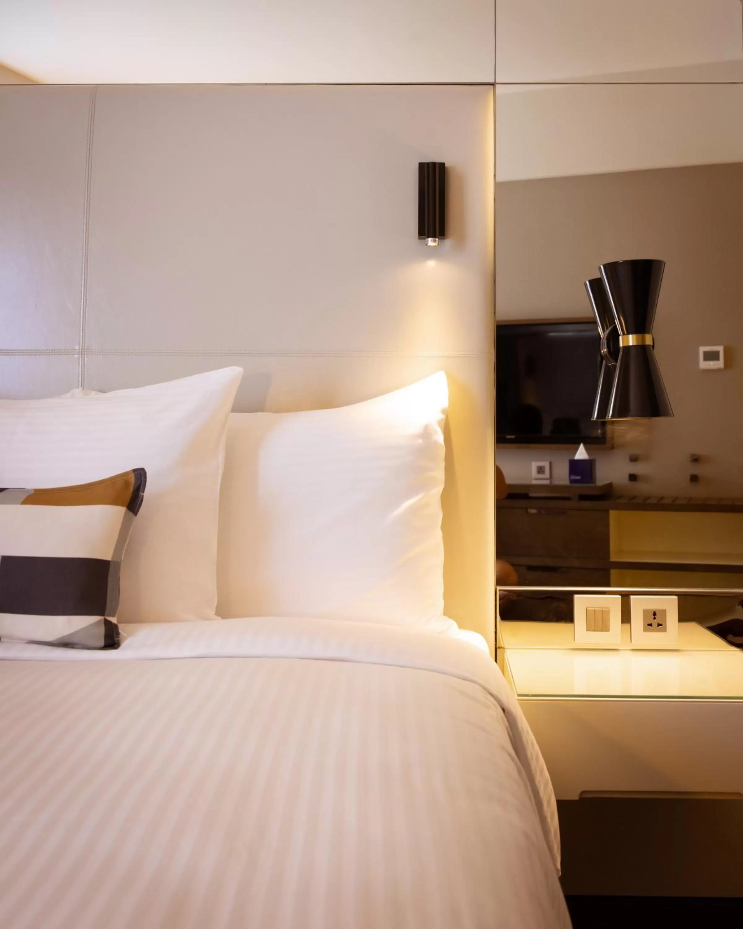 Bed in Centro Mada Amman by Rotana