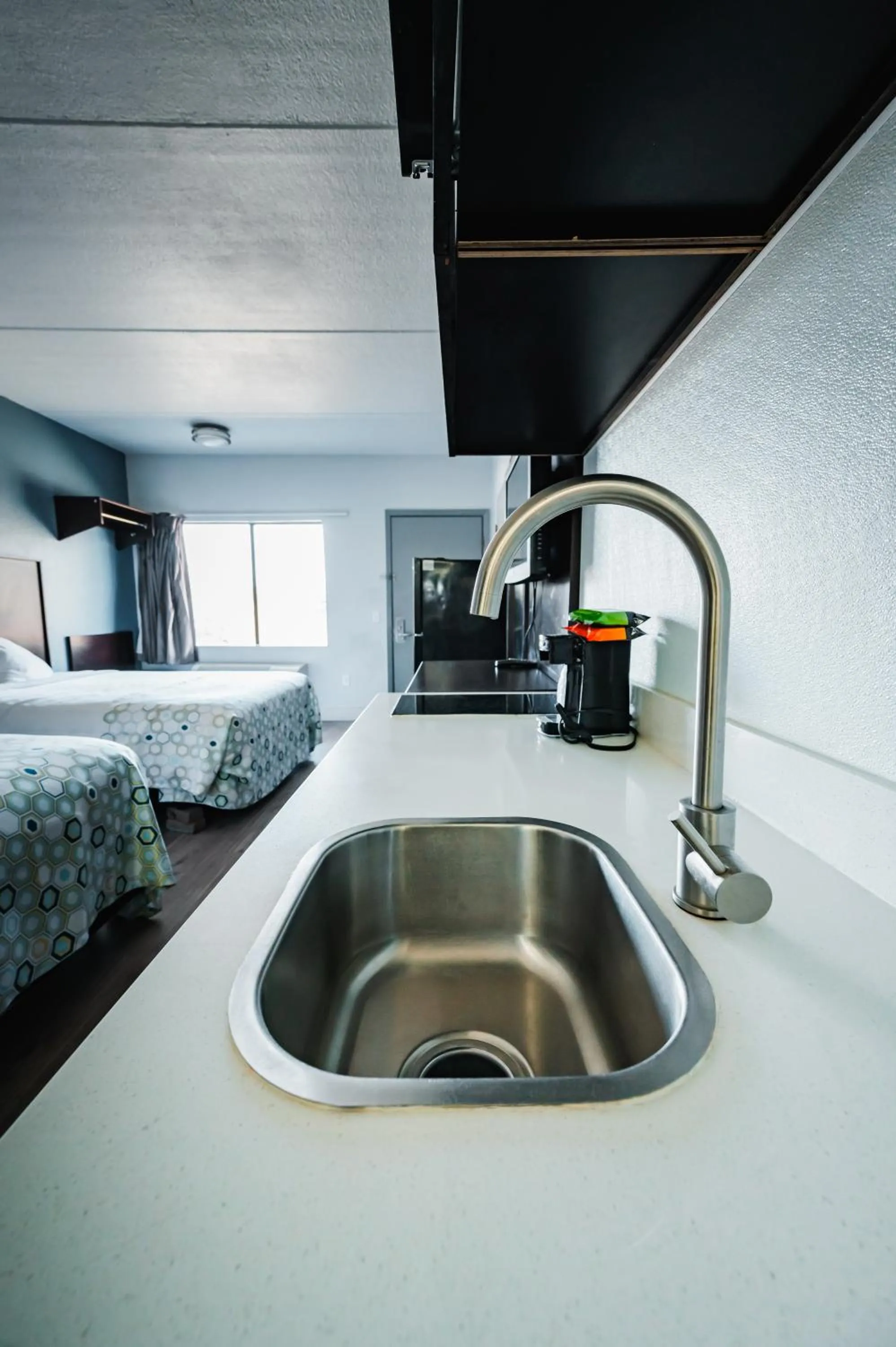 Kitchen or kitchenette, Bed in HomeTowne Studios by Red Roof San Antonio - SeaWorld Northwest