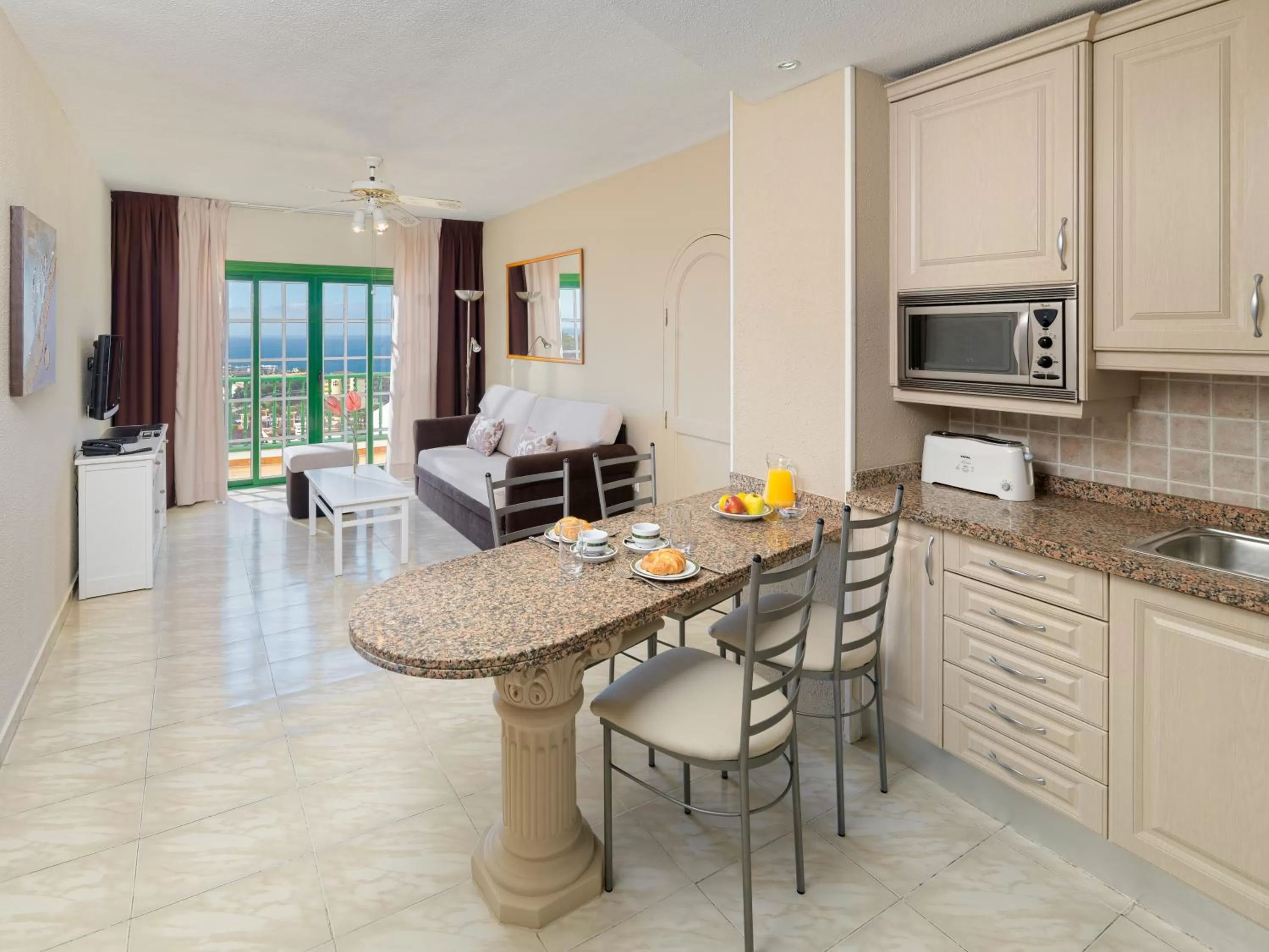 Seating area in Regency Torviscas Apartments and Suites