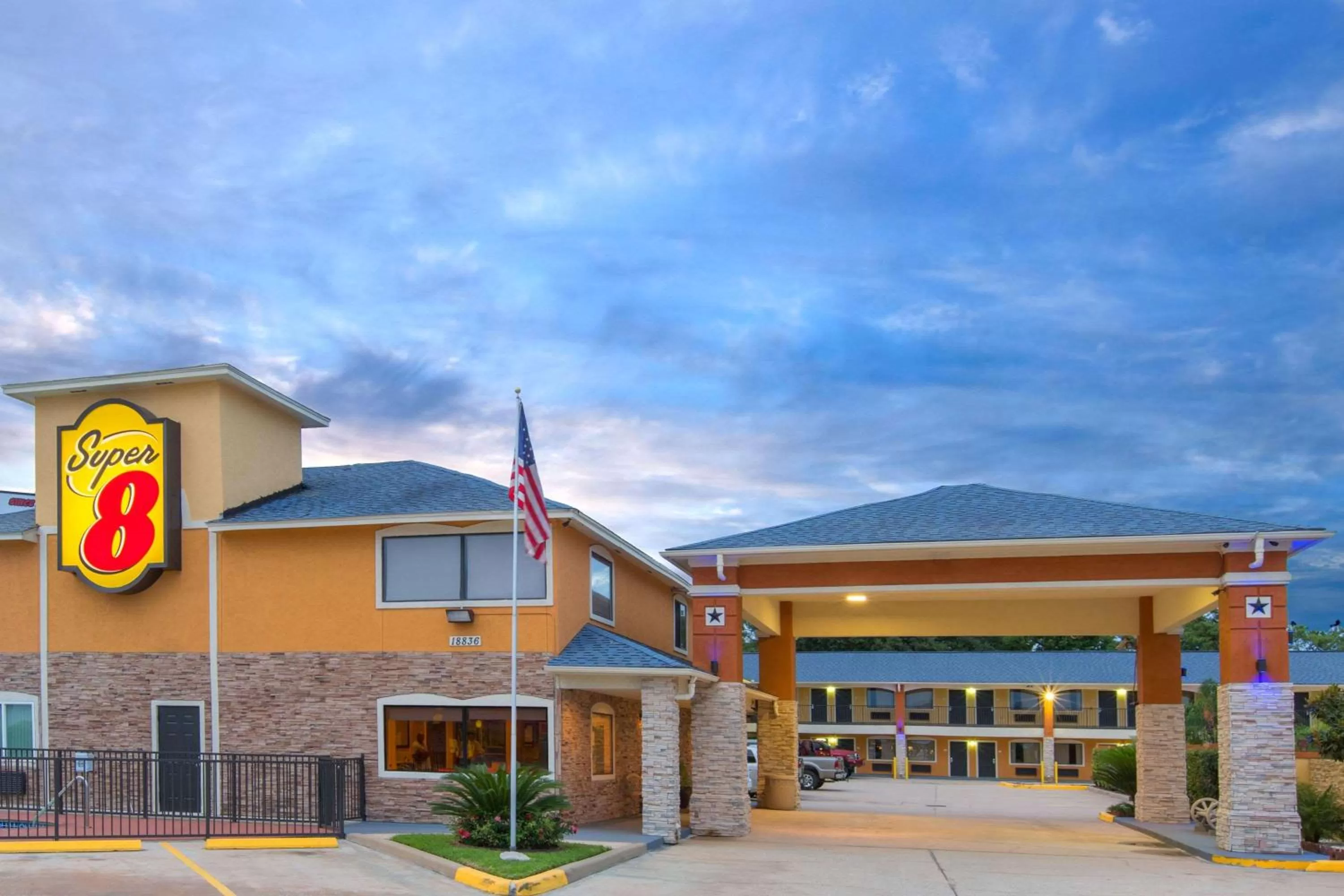 Property building in Super 8 by Wyndham Willowbrook Houston