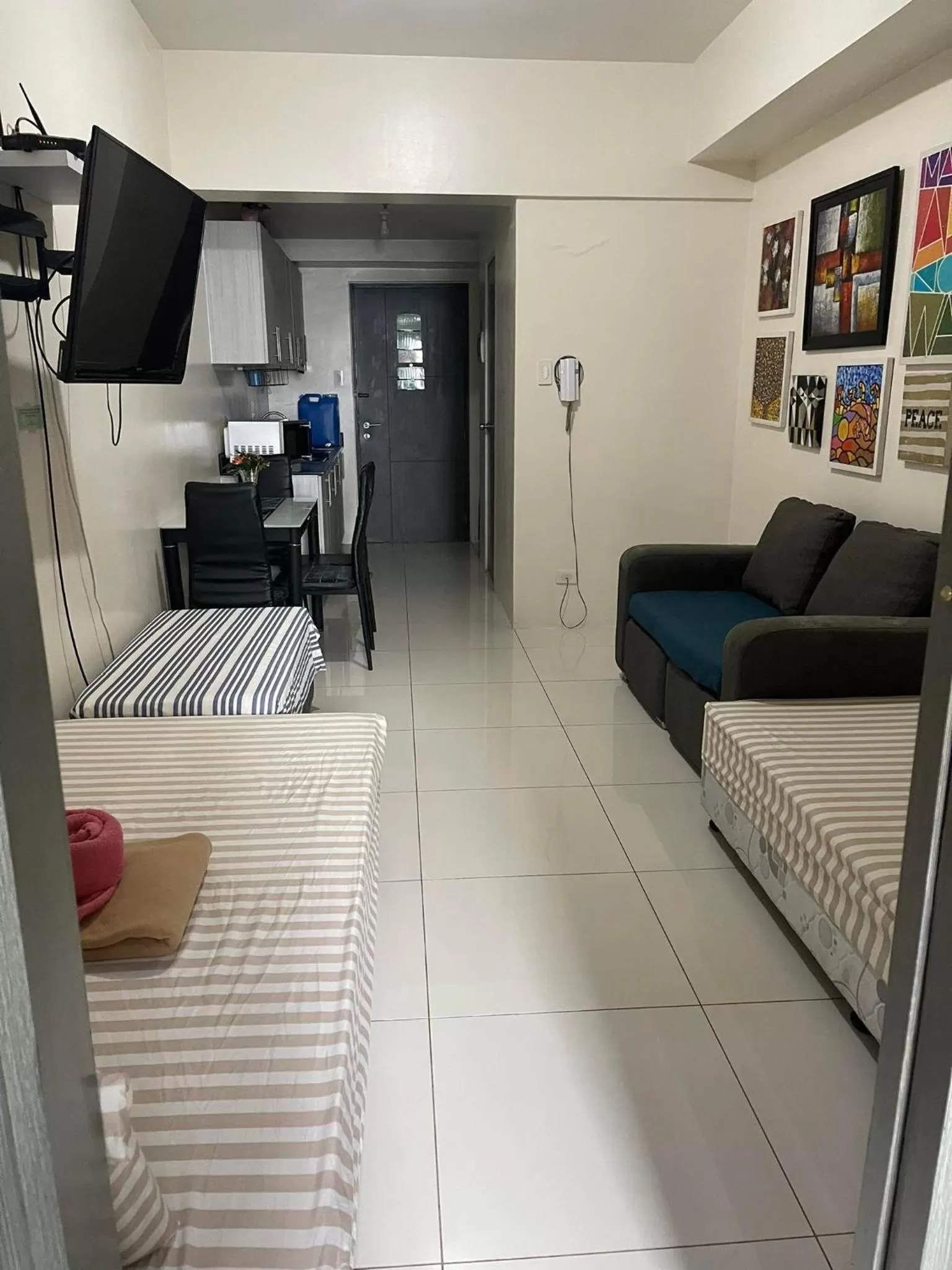 Bedroom, Seating Area in Green Residences Staycation by PBYY