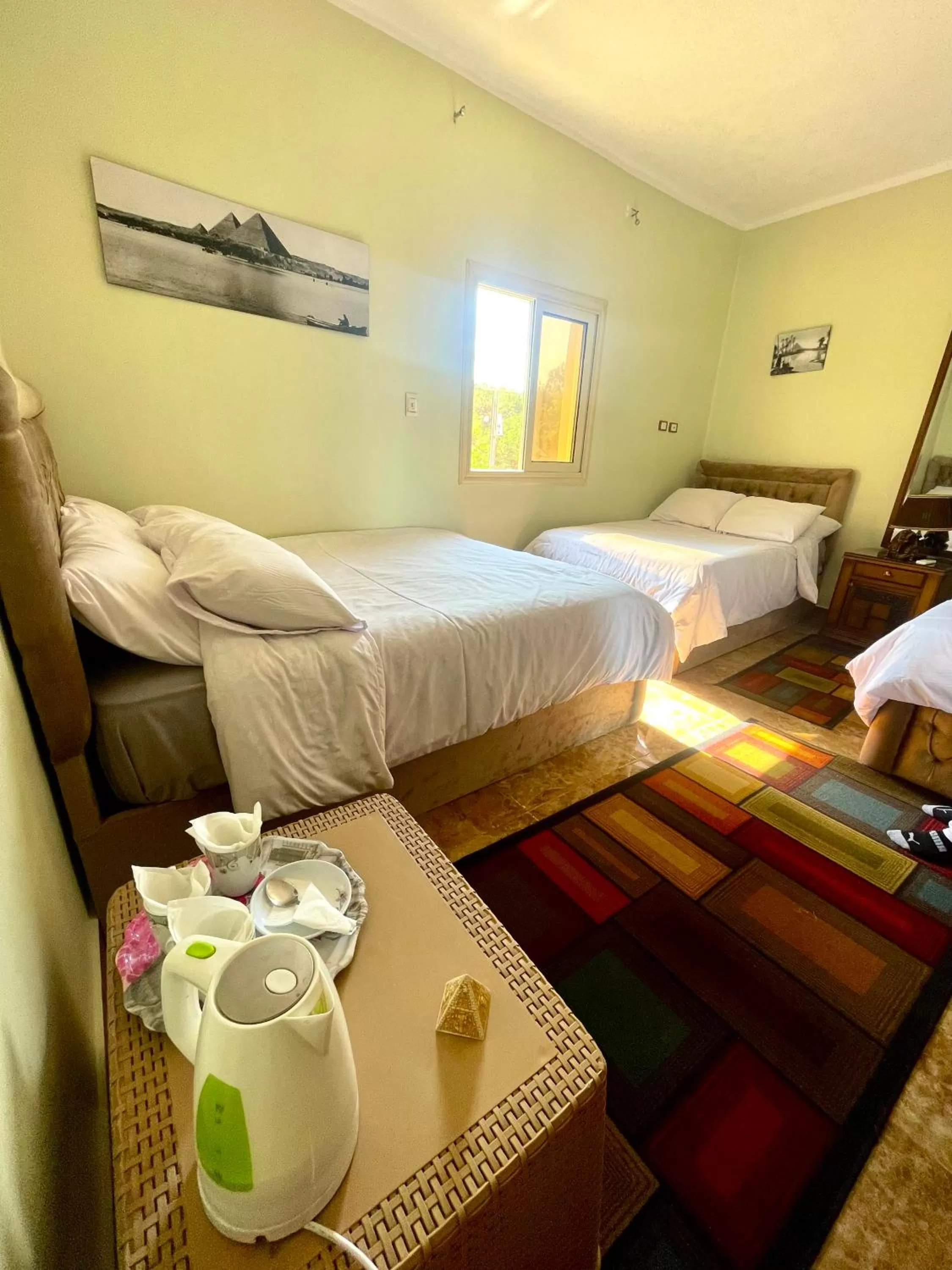 Bed in Sphinx palace pyramids view