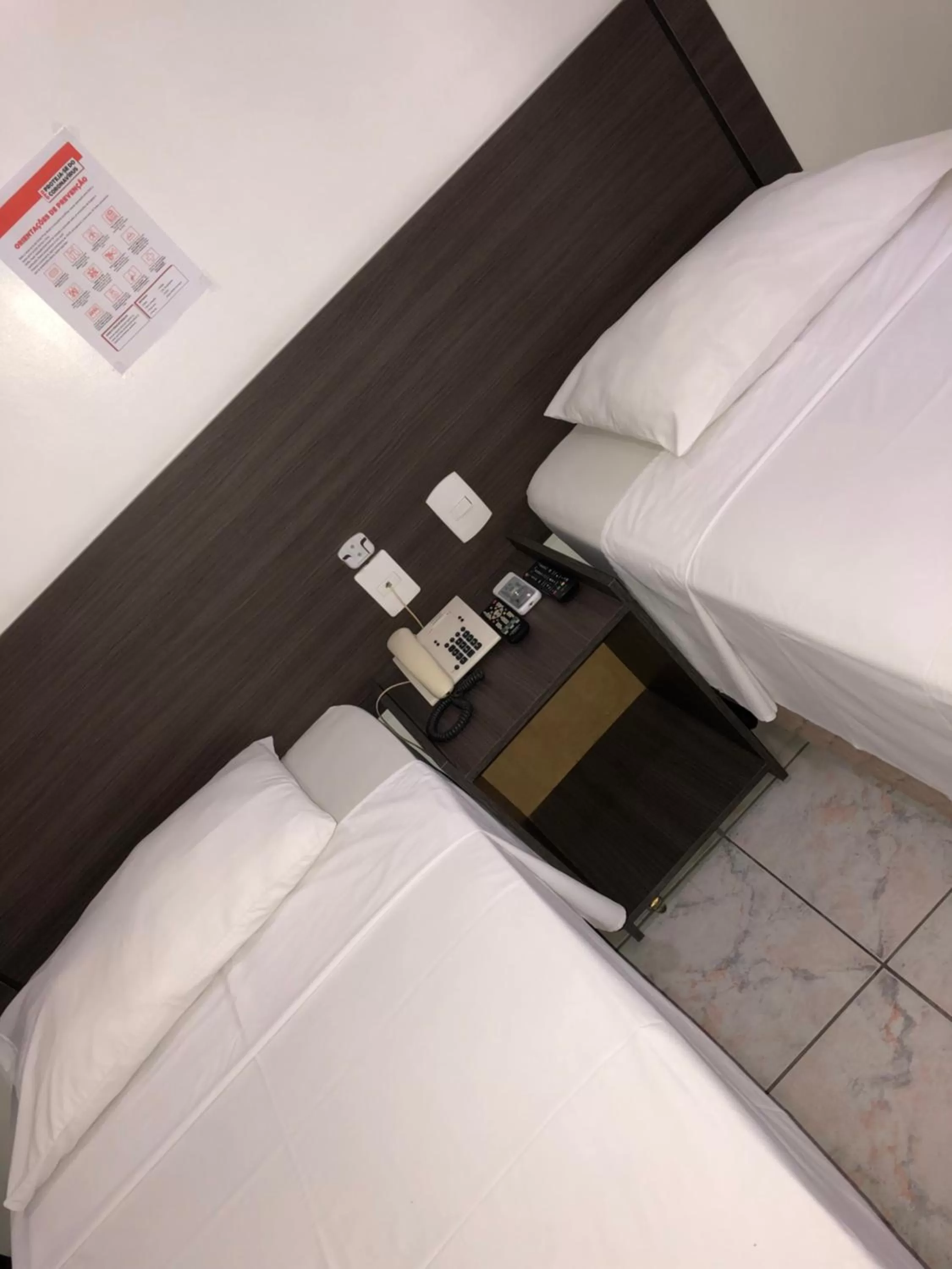 Bed in Center Plaza Hotel