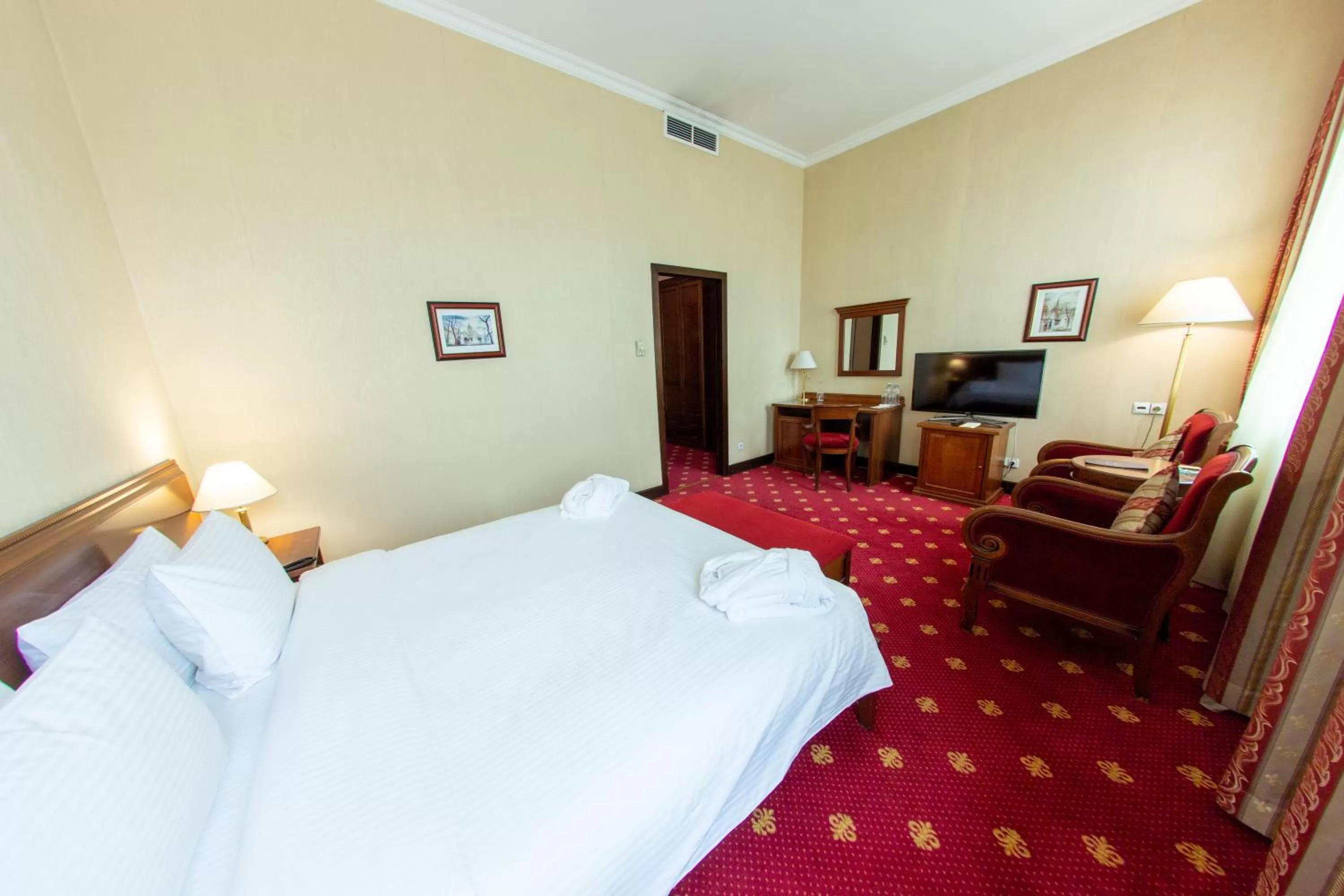 Bed in Grand Tien Shan Hotel