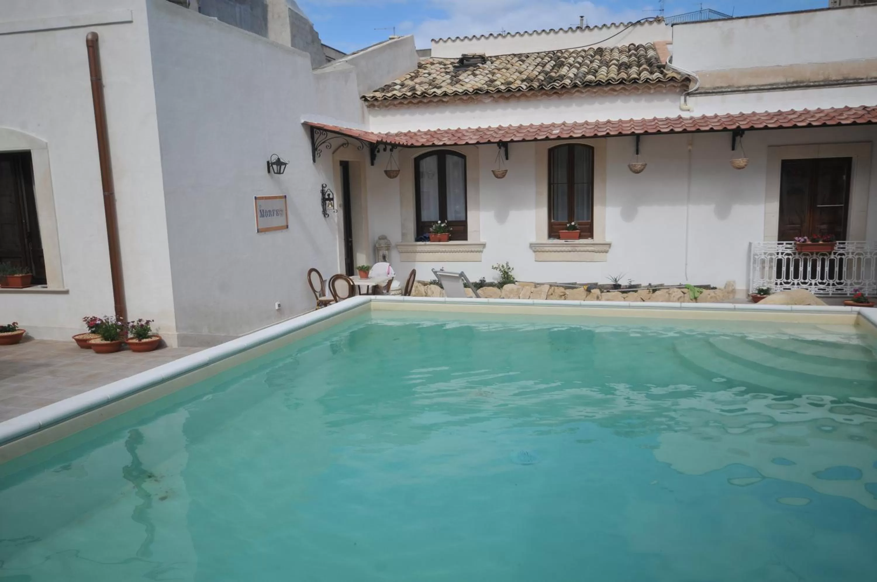 Swimming pool in Morfeo Charming Rooms & Relax