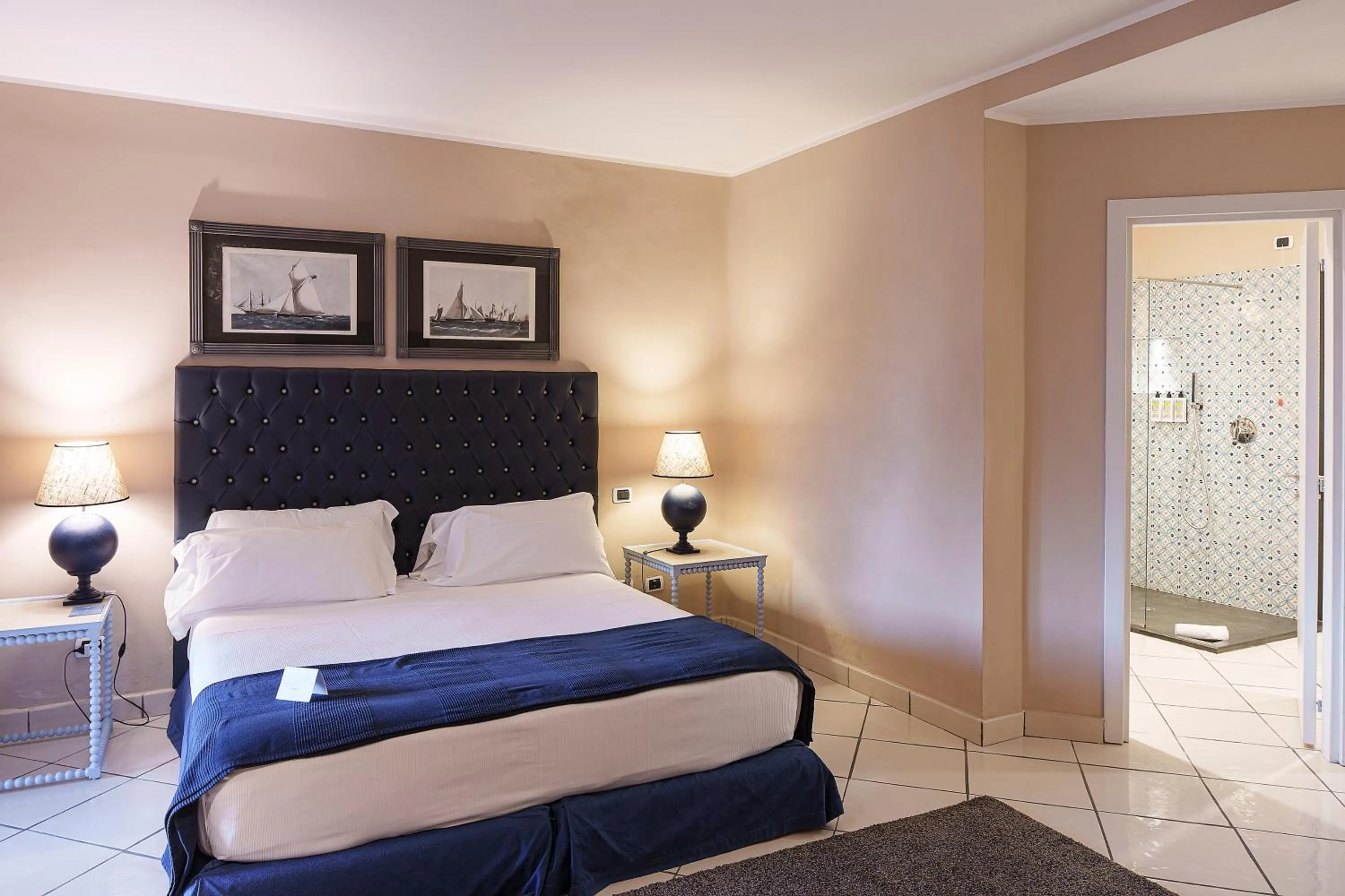 Bed in Therasia Resort Sea and SPA - The Leading Hotels of the World