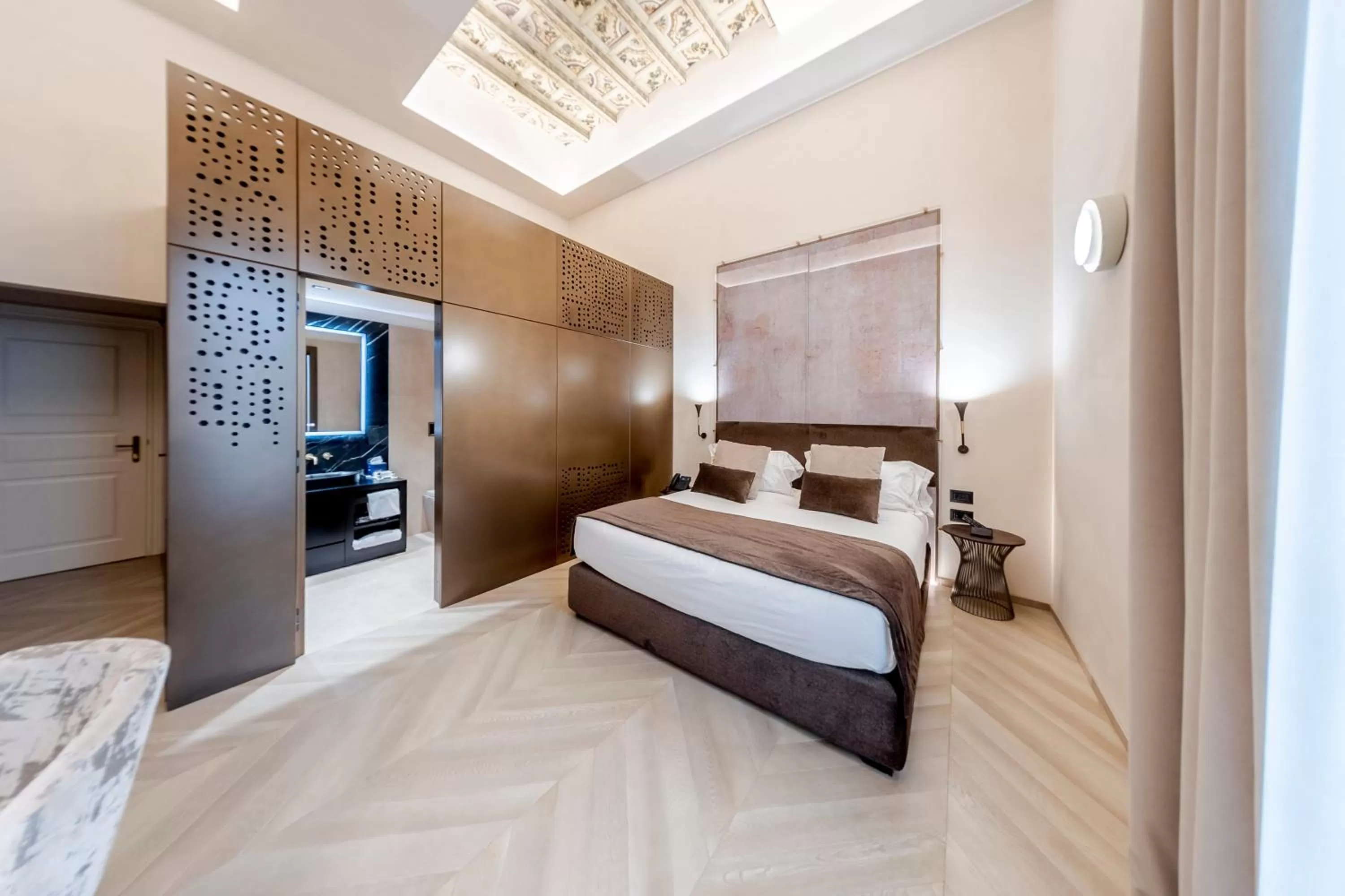 Bed in Martius Private Suites Hotel