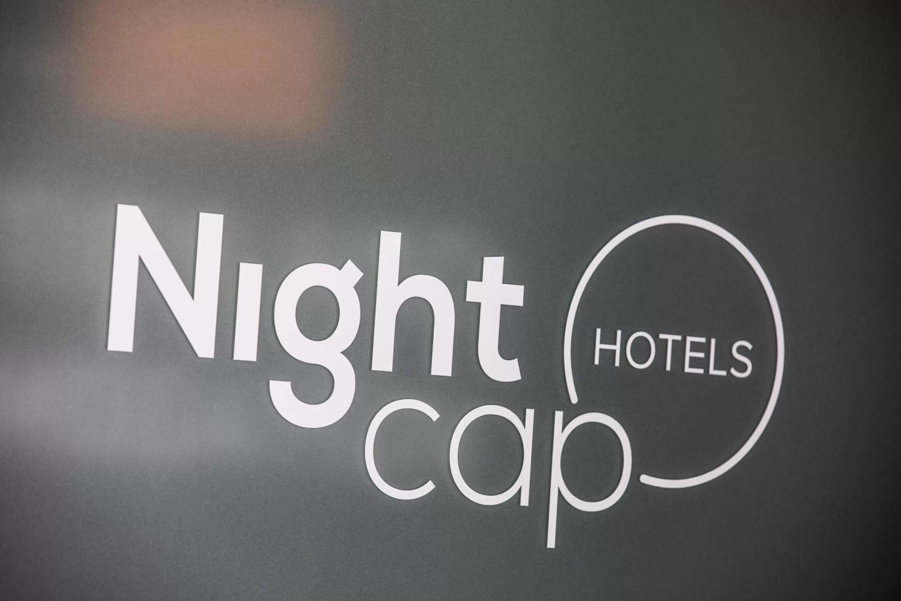 Property logo or sign in Nightcap at the Ranch Hotel