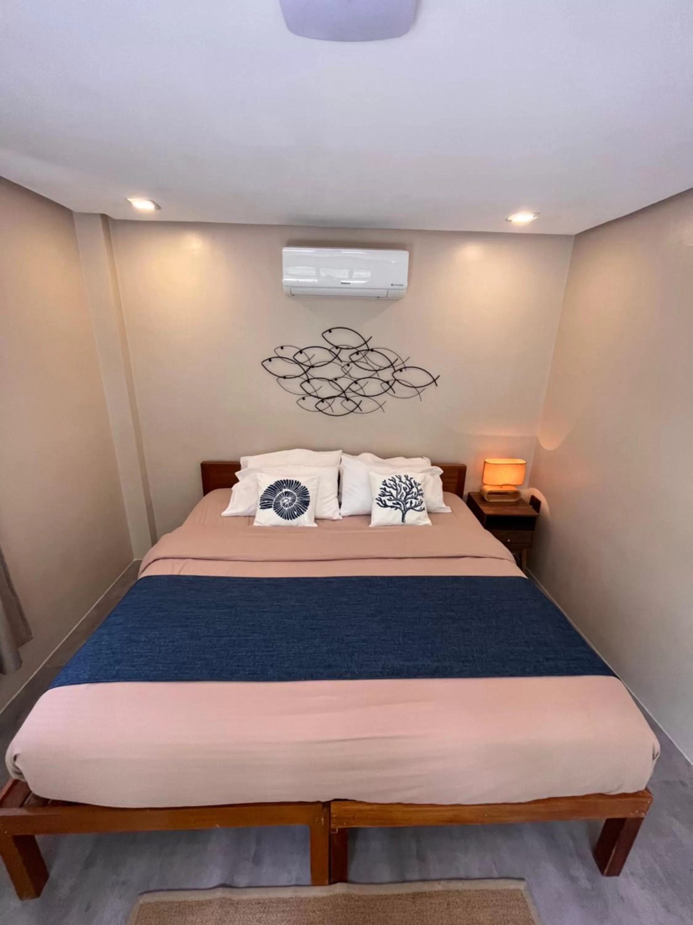 Bed in Southseas Beach Resort and Dive Center