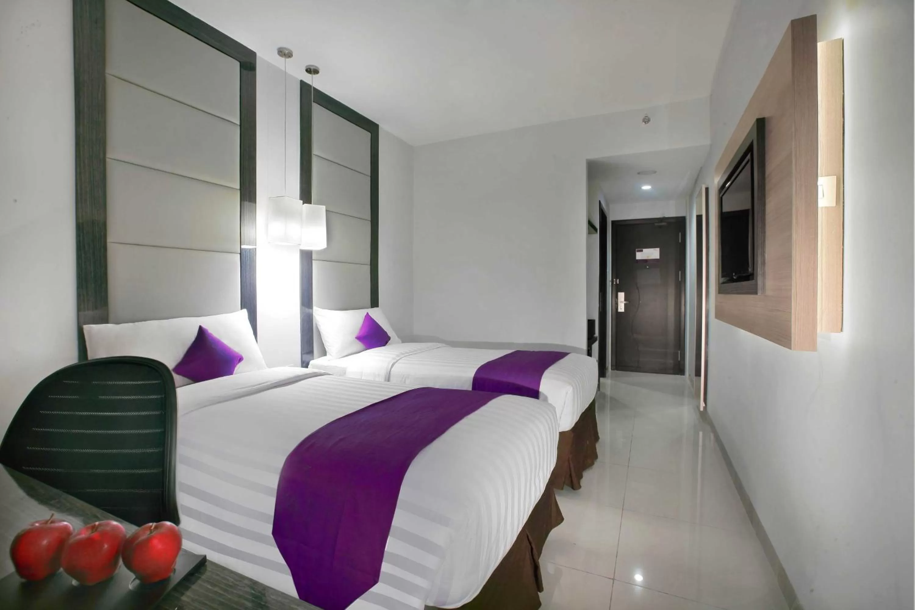 Bed in Quest Hotel Balikpapan by ASTON