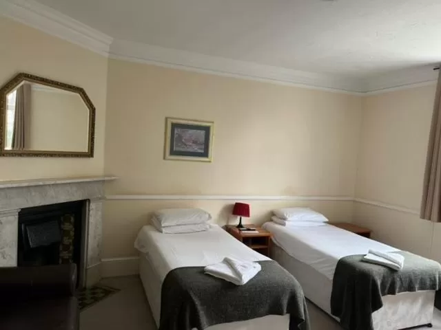 Bed in The Admiral Cunningham Hotel