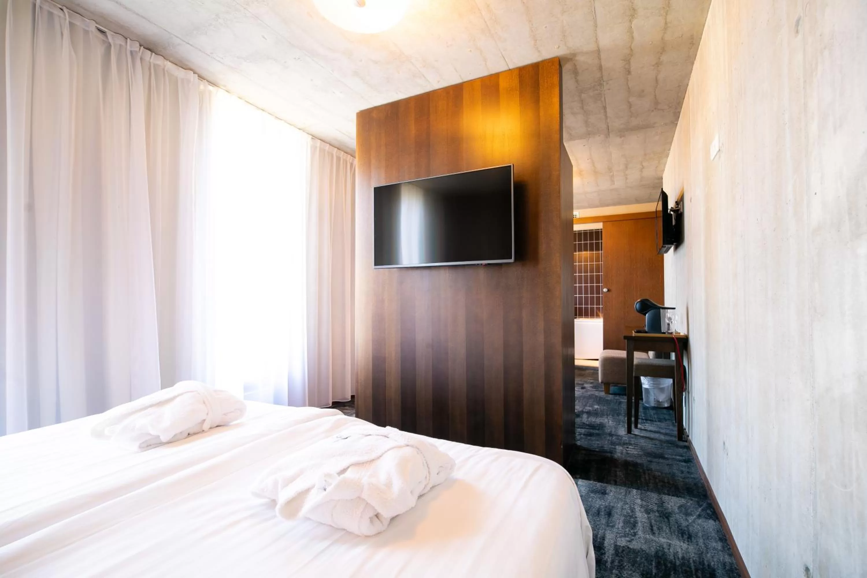 Bed in Johan Design & SPA Hotel